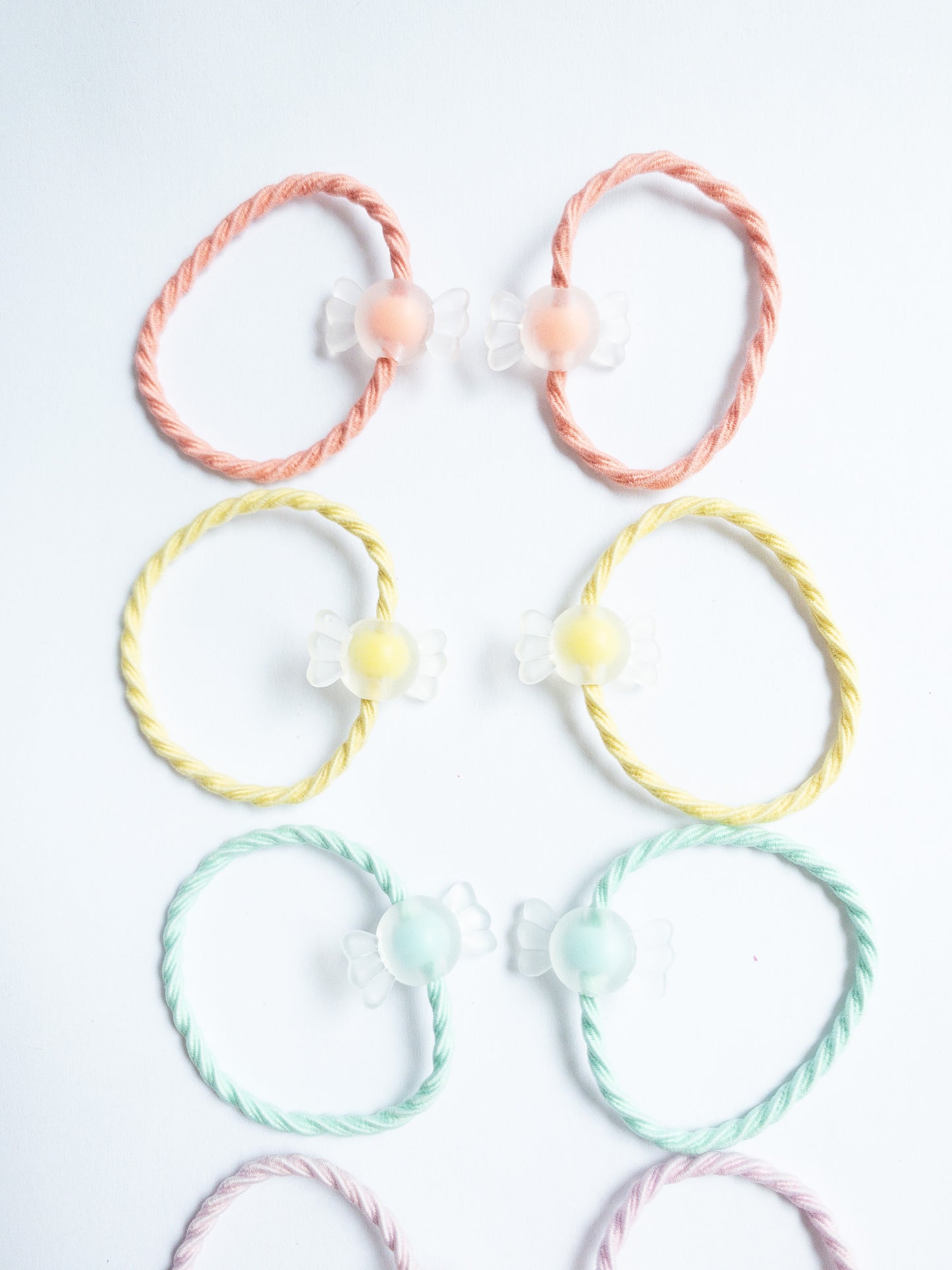 Cute little milky yogurt candies on fabric soft hair ties. Each set contains 10 hair ties.