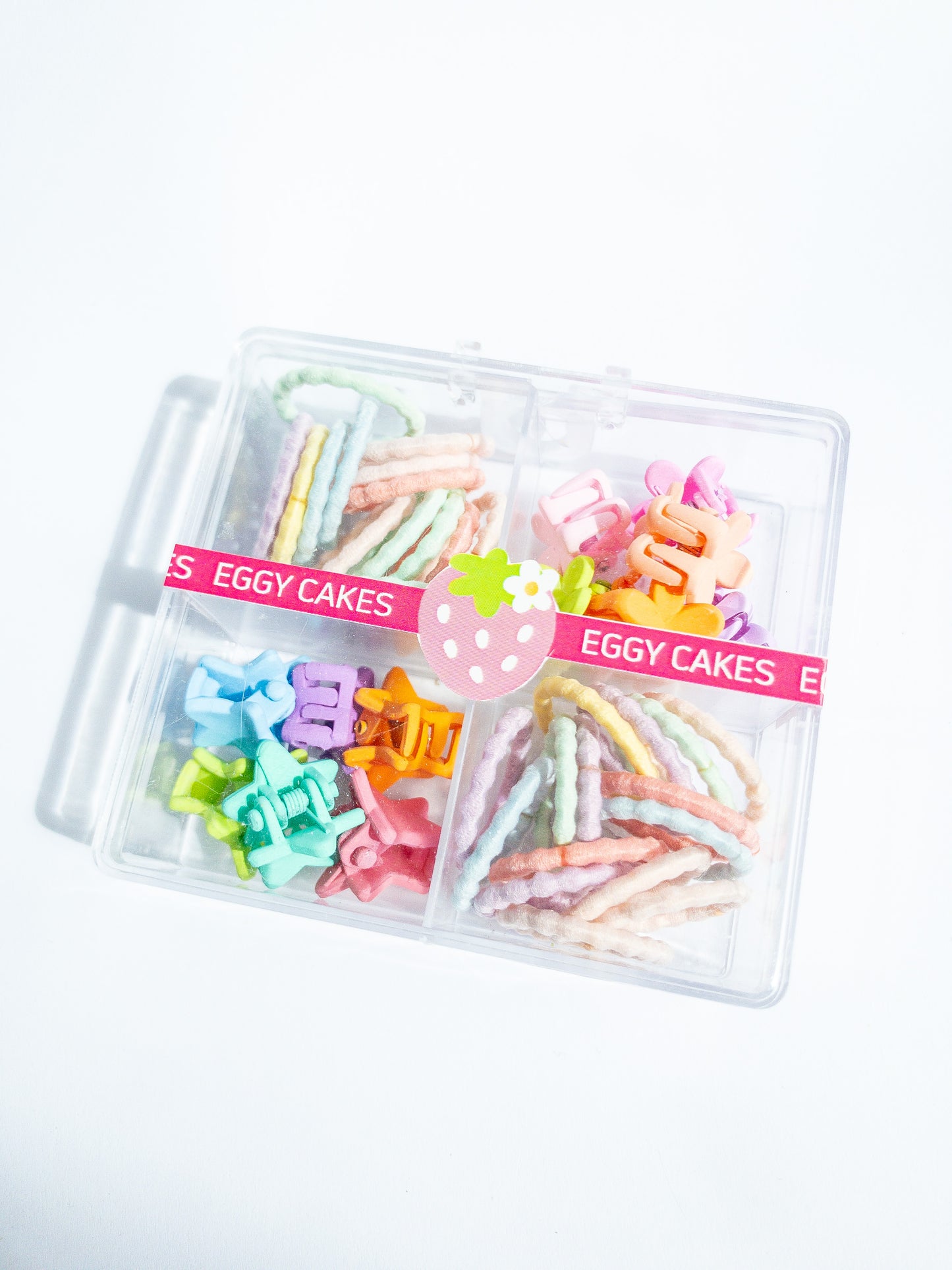 This mini hair claw set is the one you need! A boxed set with a mix of mini flower hair claws and a mix of mini star hair claws along with small hair ties. The hair ties are super soft, no tug and thin, perfect for those cute pigtails or braids. Clip the hair claws throughout to make that fun style.