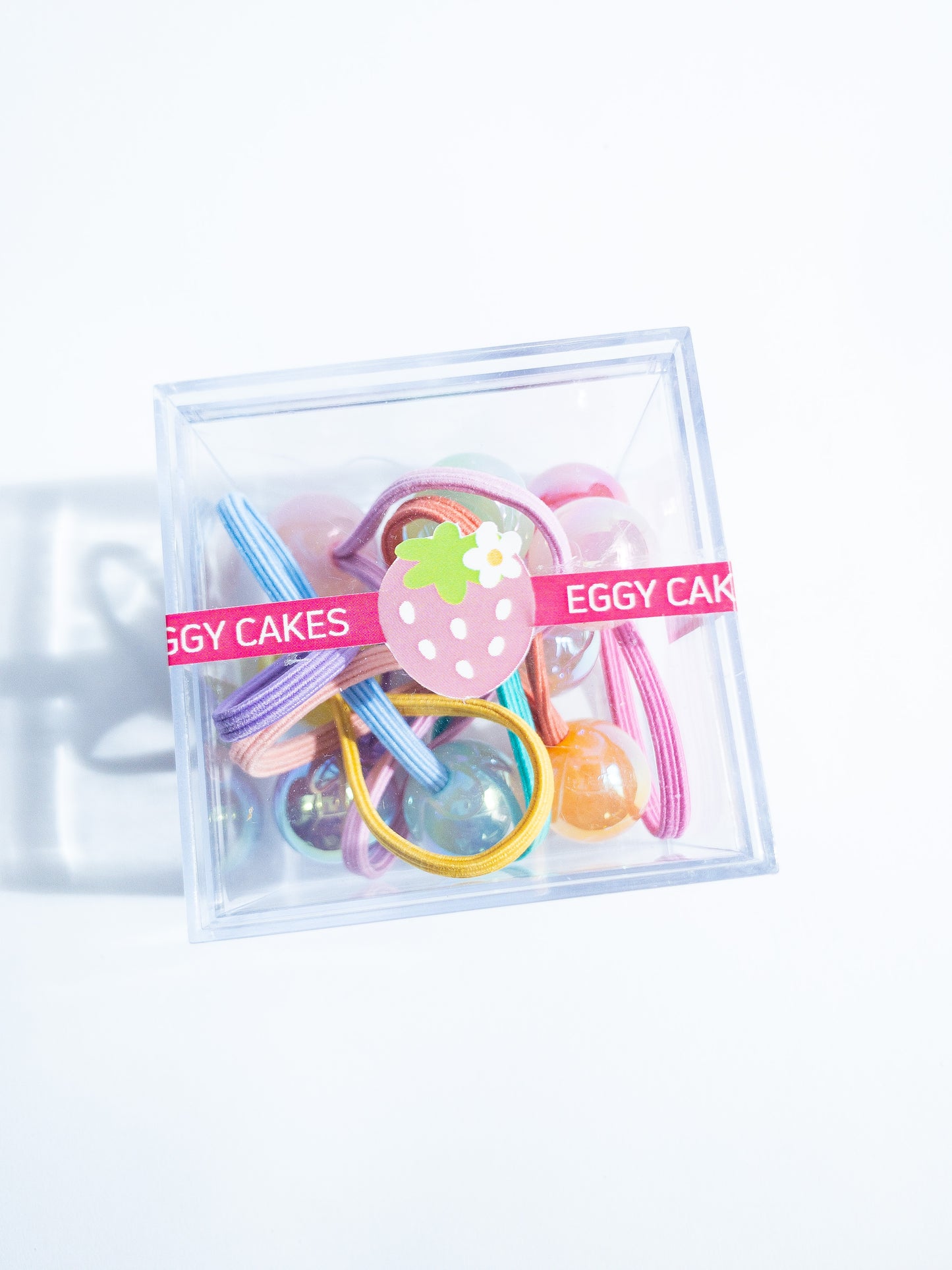Dreamy, iridescent bubble ball hair ties! These pearly hair ties glisten and gleam in candy taffy colors. They're strong enough to hold hairstyles and cute enough to wear them all at once. Each set contains 10 hai