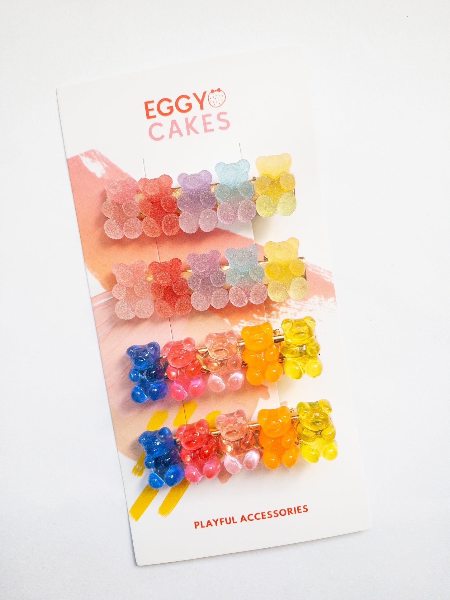 Yummy gummy bear family! The most adorable gummy bear shaped hair clips come as a 4 piece set: two frosted, sugary gummy bears and two translucent rainbow colored gummy bears. Each is on a gold colored alligator clip.