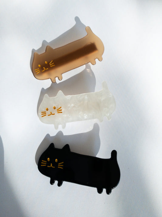 Do not fear, the meow crew is here! Long, slinky, happy cat hair clips in light brown, midnight black and shimmery, swirly white.