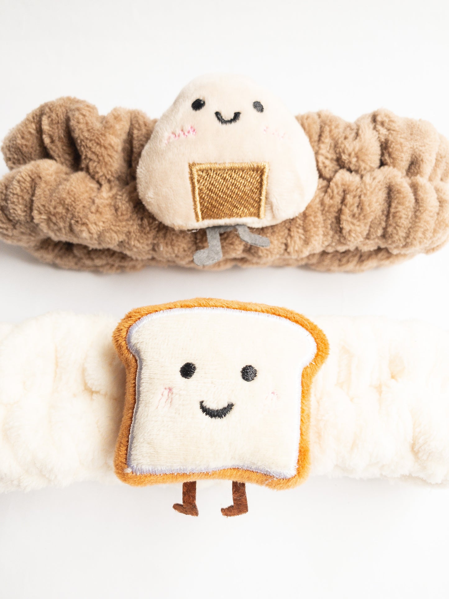 Our adorable brick toast plush spa headband makes the perfect accessory for all your spa days! Each headband is so soft and comfy with a cute and happy little brick toast. Pamper yourself in plushy-goodness and sweet, sweet relaxation! Go ahead, you deserve it!