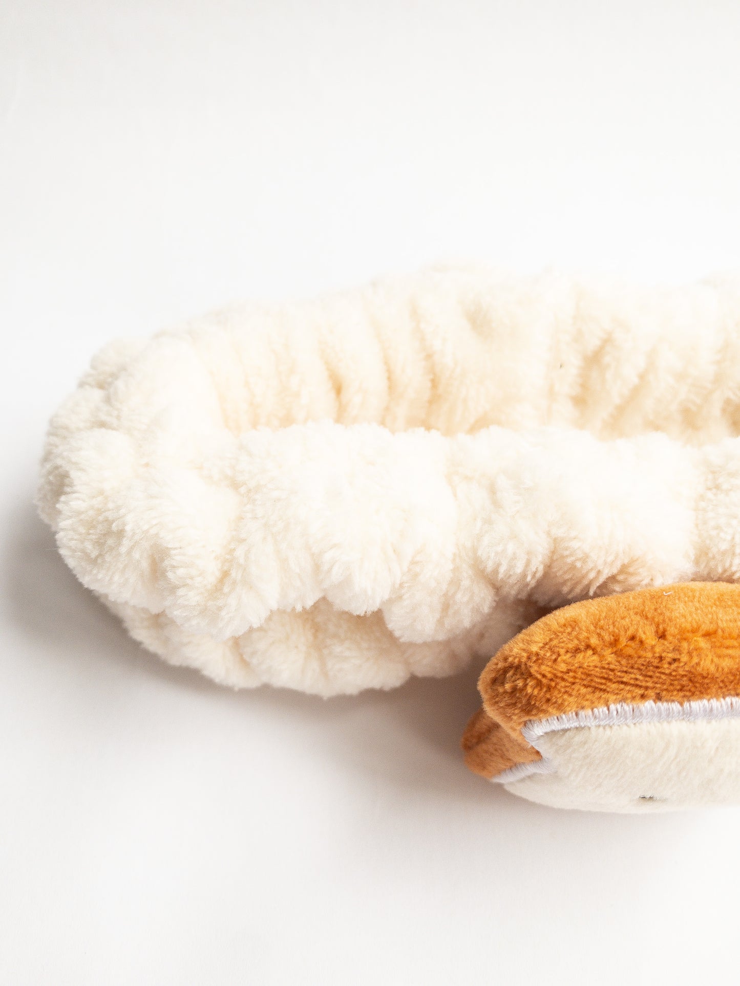 Our adorable brick toast plush spa headband makes the perfect accessory for all your spa days! Each headband is so soft and comfy with a cute and happy little brick toast. Pamper yourself in plushy-goodness and sweet, sweet relaxation! Go ahead, you deserve it!
