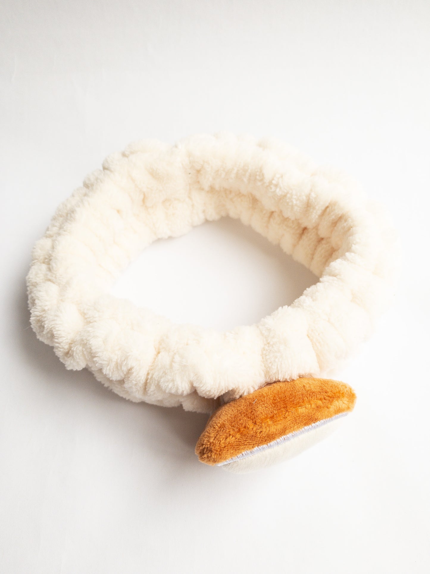 Our adorable brick toast plush spa headband makes the perfect accessory for all your spa days! Each headband is so soft and comfy with a cute and happy little brick toast. Pamper yourself in plushy-goodness and sweet, sweet relaxation! Go ahead, you deserve it!