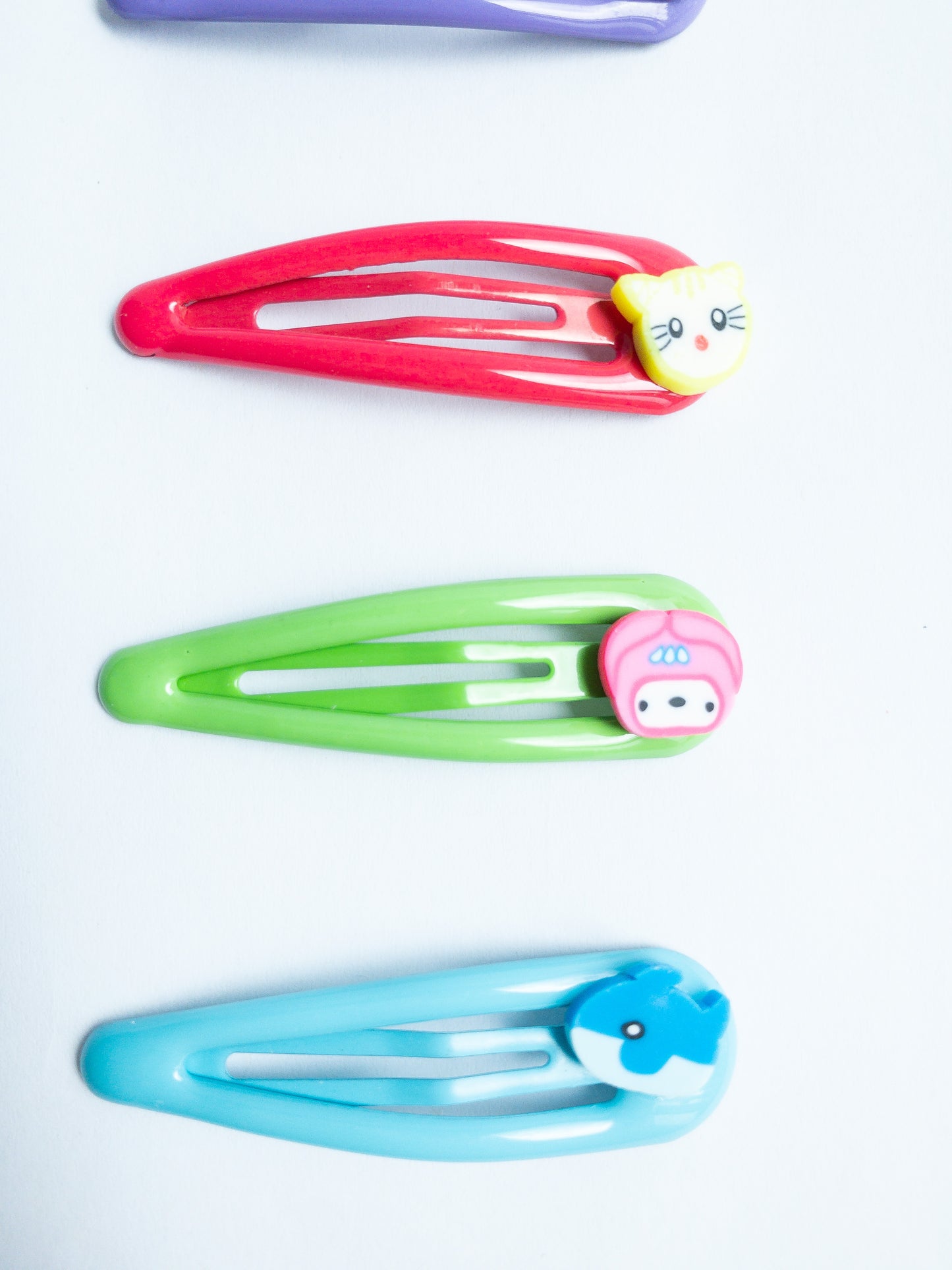 Adorn your 'do with these cute little animal hair clips! Featuring an array of critters, these super-cute clips are perfect for adding a bit of fun to your look. Five bright colored snap clips.
