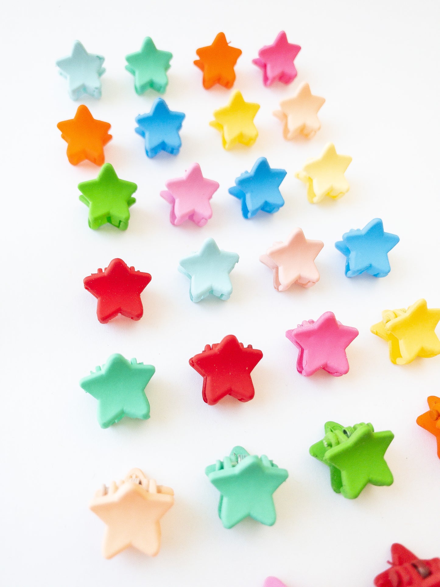 Our signature Korean style mini star hair clips! Each hair clip is only half an inch in length and is great for clipping your hair back in pretty starry rows or using one or two to keep your hair from your face. Each box comes with 36 dainty pieces in a variety of pretty colors in our very own Eggy Cakes box. These really are a must have!