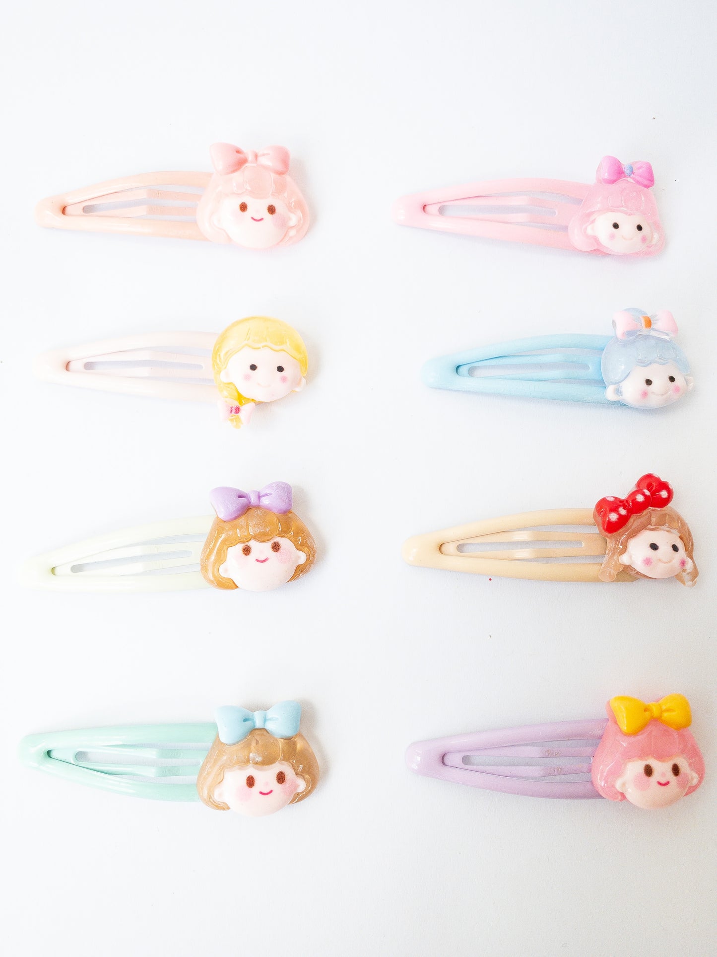A sweet and mighty set of cartoon girl characters on glossy, pastel snap clips! Each set has 8 girl charms with a cute b