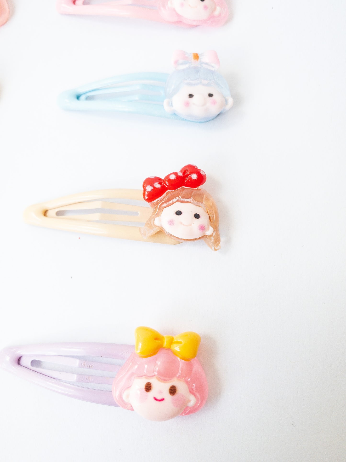 A sweet and mighty set of cartoon girl characters on glossy, pastel snap clips! Each set has 8 girl charms with a cute b