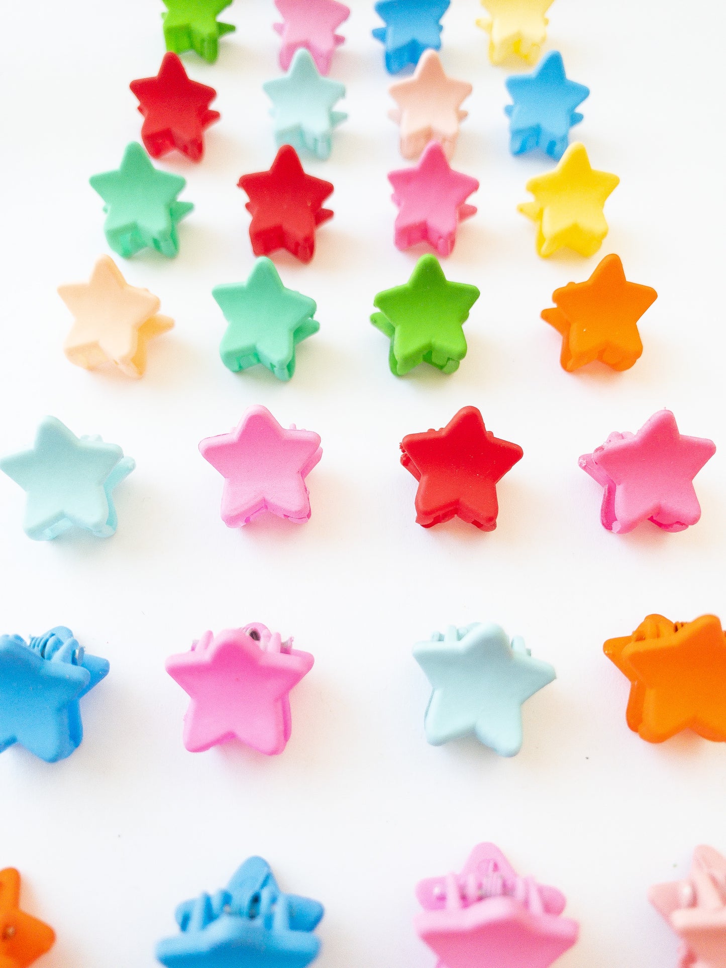 Our signature Korean style mini star hair clips! Each hair clip is only half an inch in length and is great for clipping your hair back in pretty starry rows or using one or two to keep your hair from your face. Each box comes with 36 dainty pieces in a variety of pretty colors in our very own Eggy Cakes box. These really are a must have!