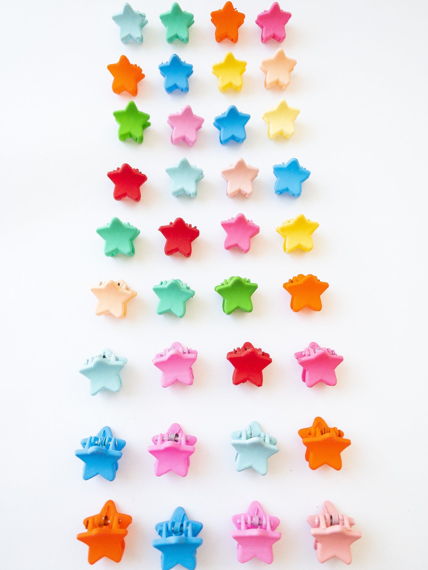 Our signature Korean style mini star hair clips! Each hair clip is only half an inch in length and is great for clipping your hair back in pretty starry rows or using one or two to keep your hair from your face. Each box comes with 36 dainty pieces in a variety of pretty colors in our very own Eggy Cakes box. These really are a must have!