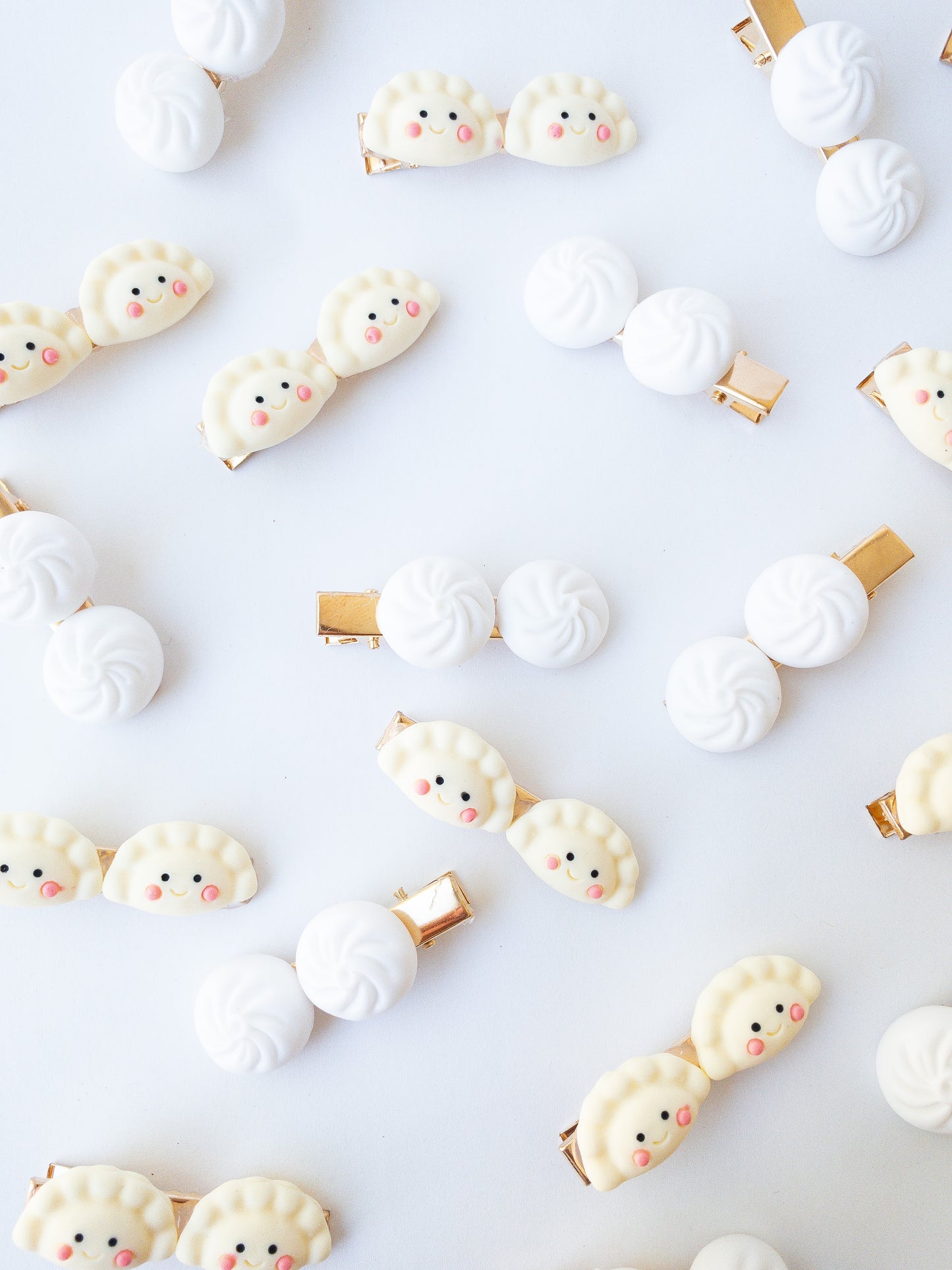 Is there anything cuter than these happy mandu dumplings and a set of bao buns? Each set comes with one mandu hair clip and one bao bun hair clip.
