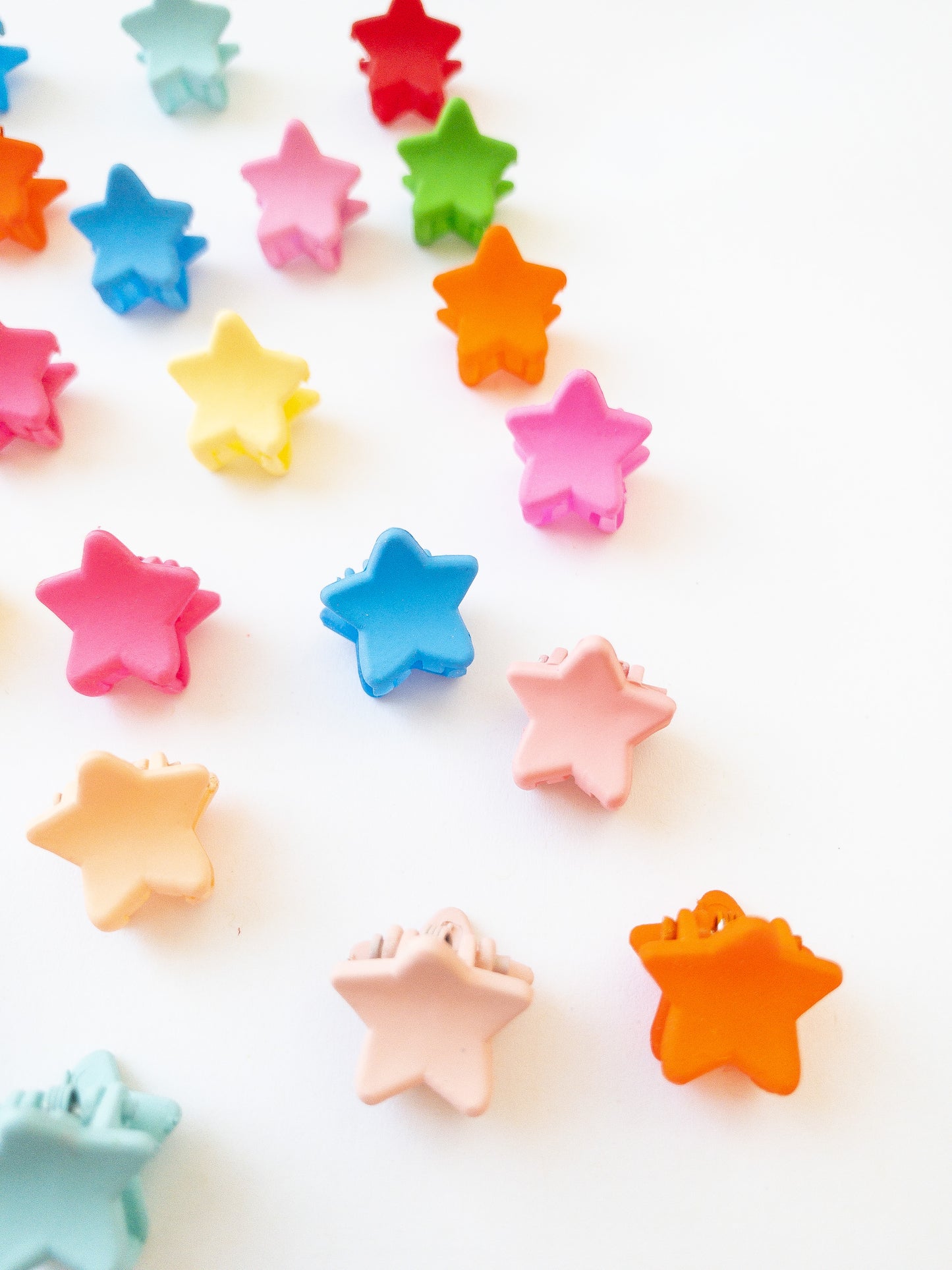 Our signature Korean style mini star hair clips! Each hair clip is only half an inch in length and is great for clipping your hair back in pretty starry rows or using one or two to keep your hair from your face. Each box comes with 36 dainty pieces in a variety of pretty colors in our very own Eggy Cakes box. These really are a must have!