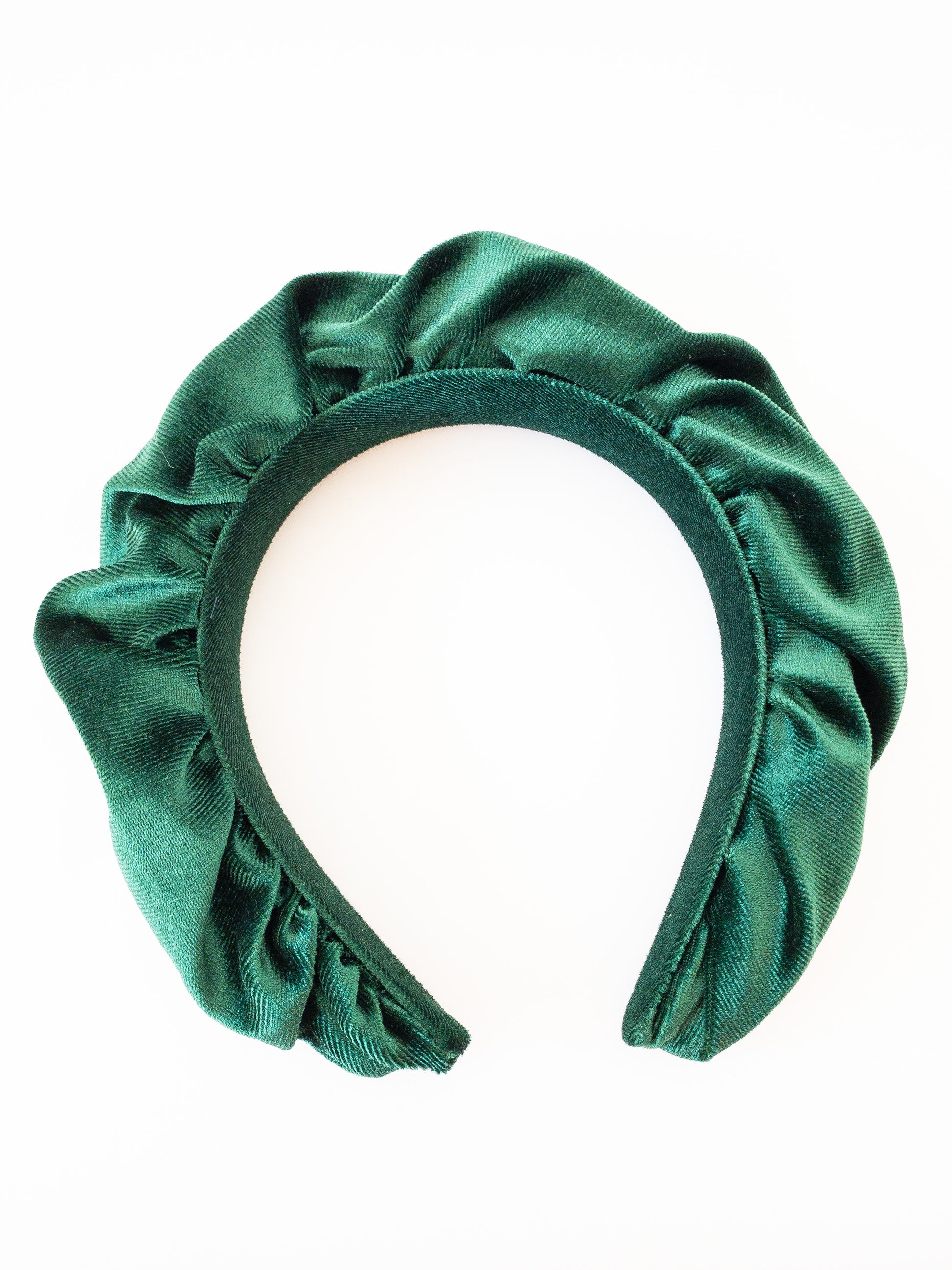 A rich, beautiful statement piece! This headband is padded and ruffled in soft, gorgeous velvet and is the perfect piece to wear out on a date or girls night out. 