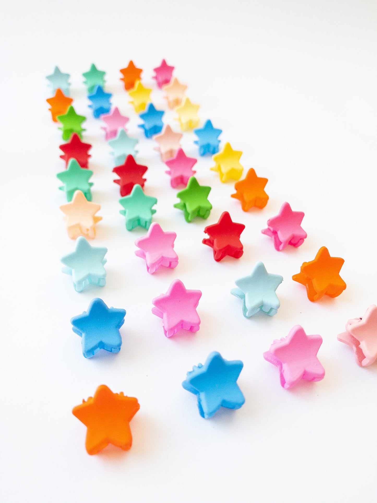 Our signature Korean style mini star hair clips! Each hair clip is only half an inch in length and is great for clipping your hair back in pretty starry rows or using one or two to keep your hair from your face. Each box comes with 36 dainty pieces in a variety of pretty colors in our very own Eggy Cakes box. These really are a must have!