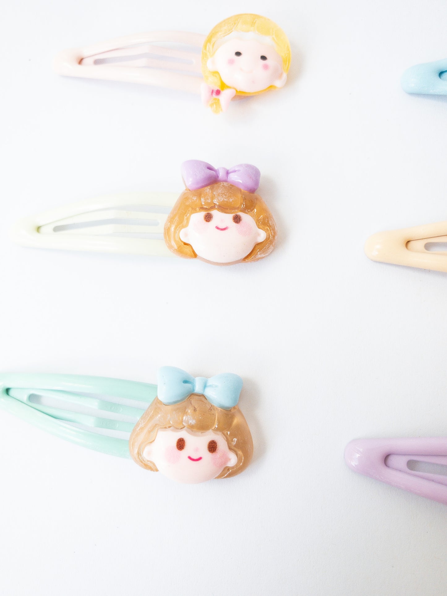 A sweet and mighty set of cartoon girl characters on glossy, pastel snap clips! Each set has 8 girl charms with a cute b