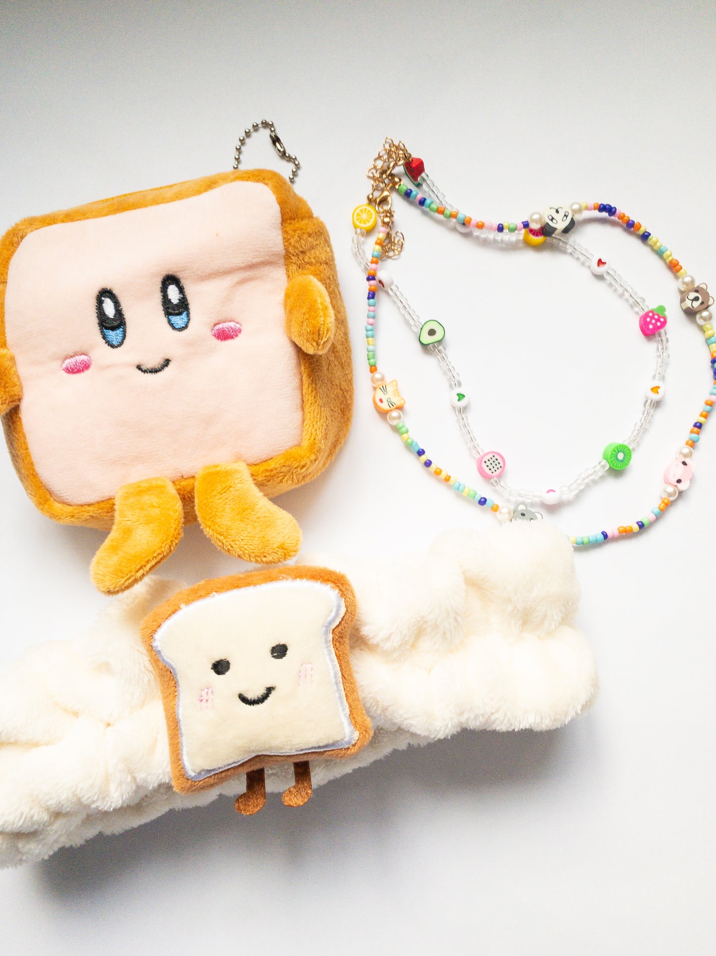 A collection of your favorite dessert--the Brick Toast! This bundle includes the Brick Toast Coin Purse Keychain, the Fruity Critter Necklace Set (comes with 2 necklaces), and the Brick Toast Plush Spa Headband. Save $6 with this bundle!