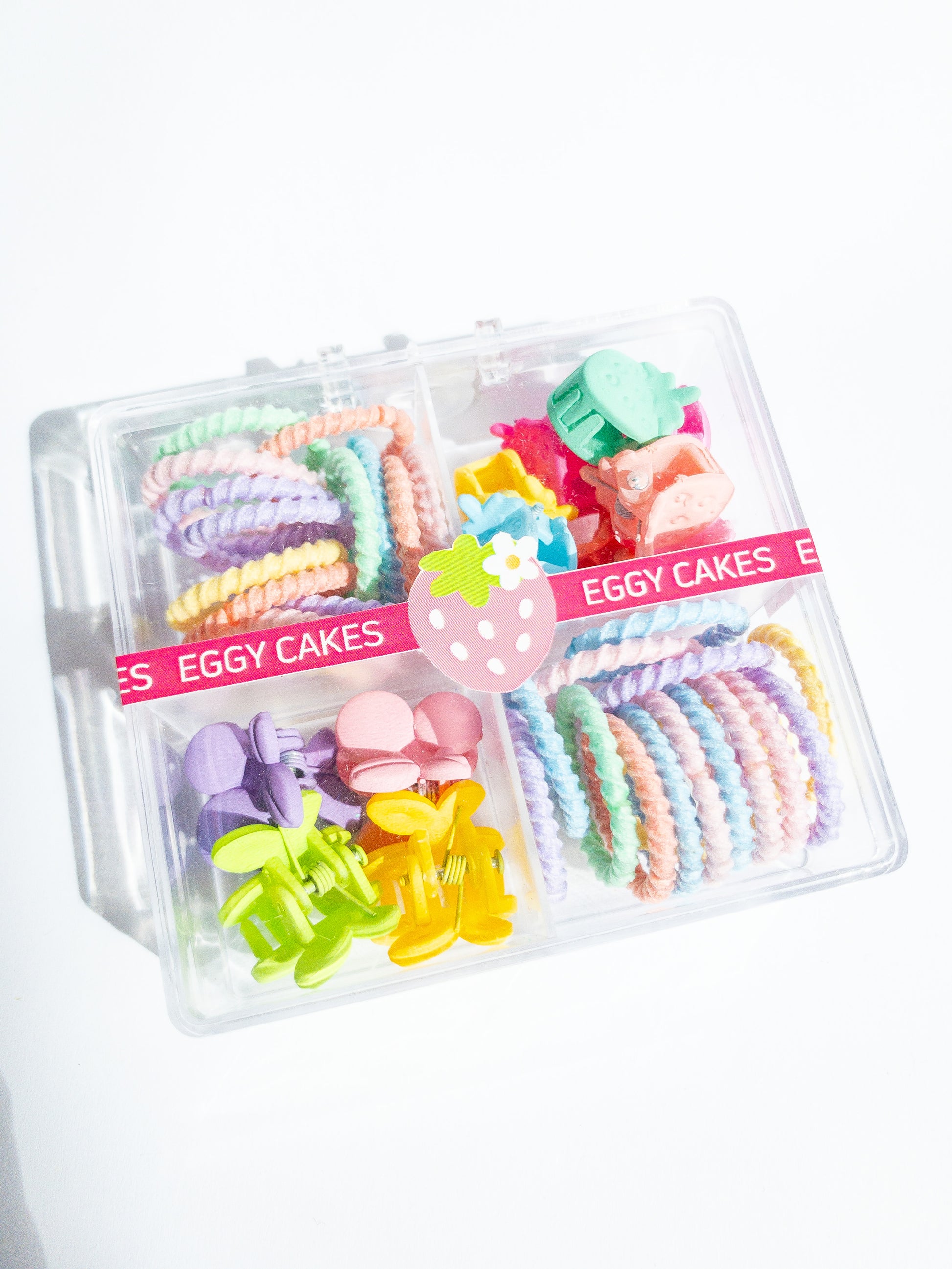 This mini hair claw set is the one you need! A boxed set with a mix of mini strawberry hair claws and a mix of small cherry hair claws along with small hair ties. The hair ties are super soft, no tug and thin, perfect for those cute pigtails or braids. Clip the hair claws throughout to make that fun style.
