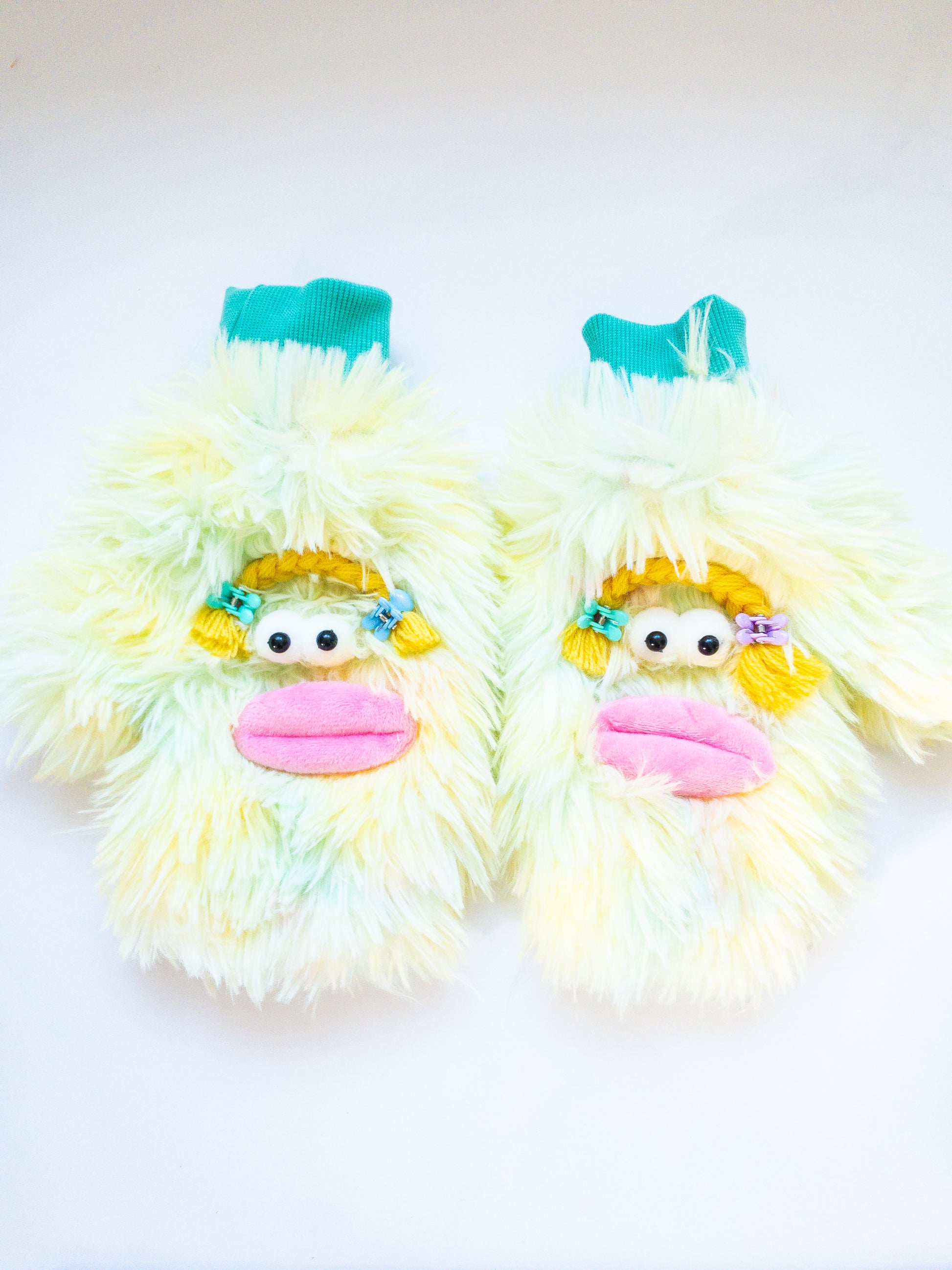Can you find any more playful mittens than these? Luxuriously soft and ombre furry mittens in a cute monster girl design. The inside is just as soft as the outside. She even has braids with Eggy Cakes mini clips! 