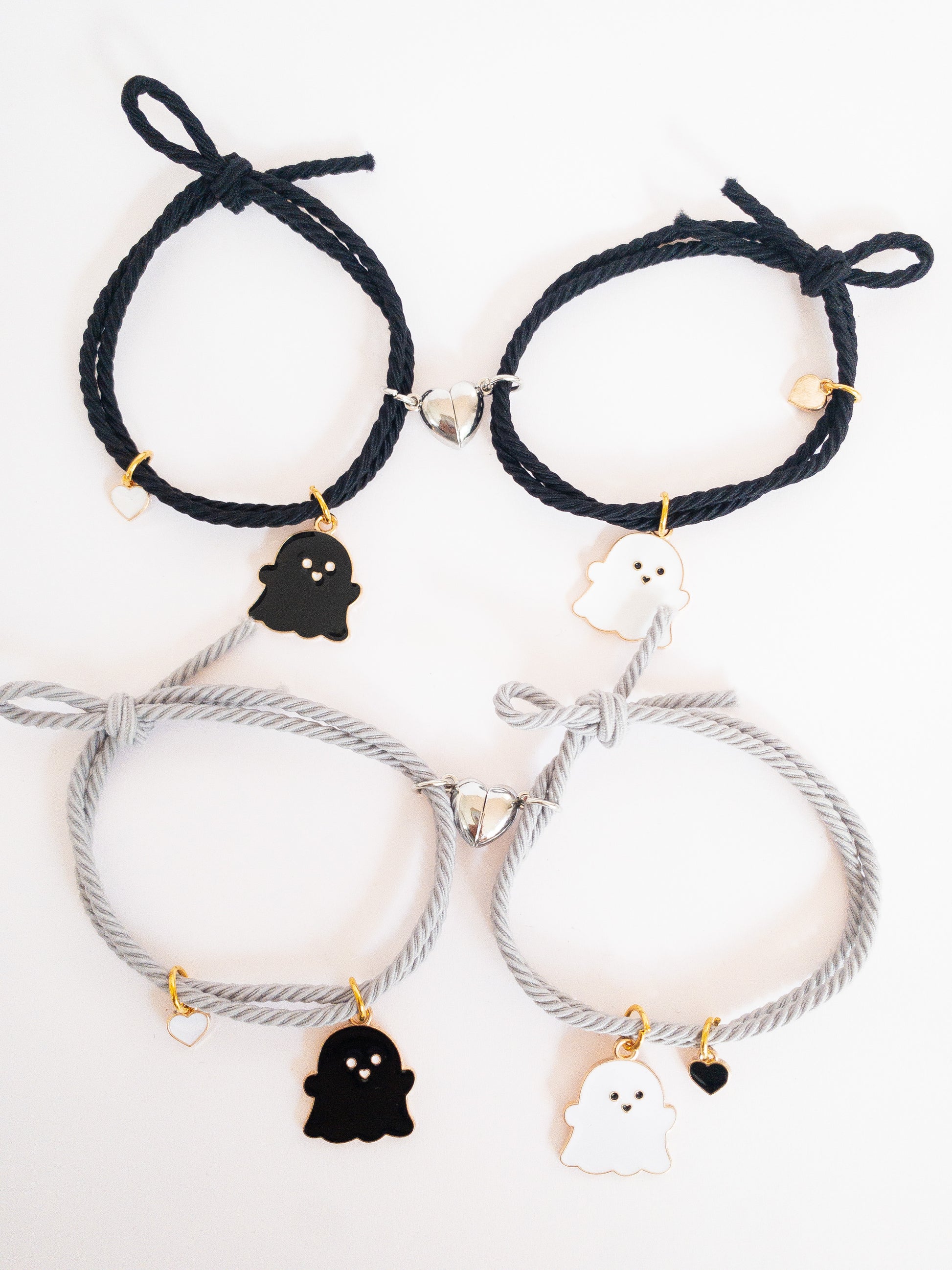 These ghostie besties are hard to keep apart! Two sets of lovable ghost hair ties that pull together when each half heart magnet matches up. They can be used as hair ties or kept on your wrist as bracelets--either way, a sweet way to remember your bestie.