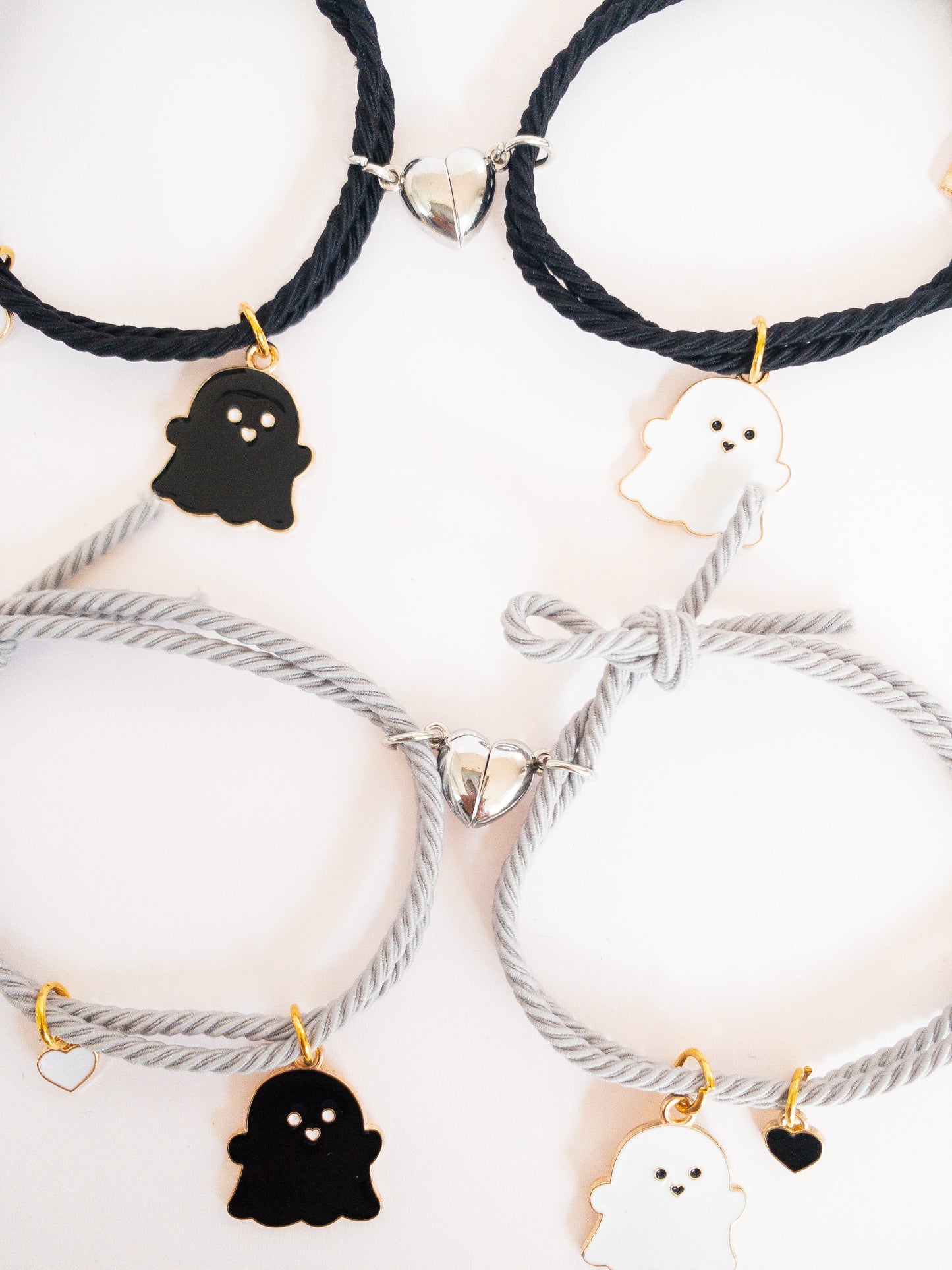 These ghostie besties are hard to keep apart! Two sets of lovable ghost hair ties that pull together when each half heart magnet matches up. They can be used as hair ties or kept on your wrist as bracelets--either way, a sweet way to remember your bestie.