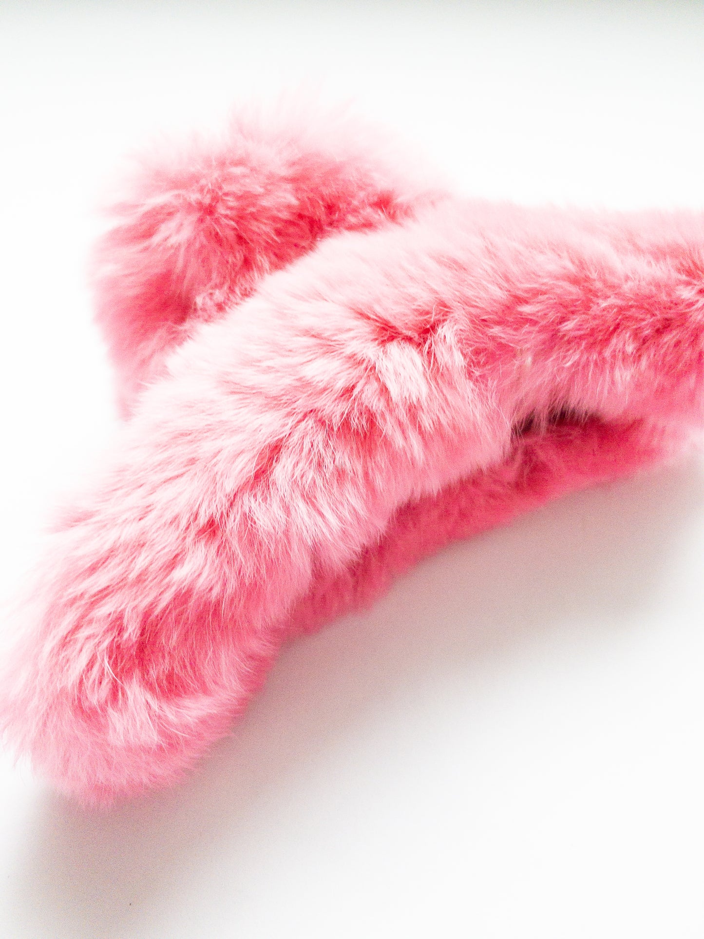 Ultra soft faux rabbit fur hair claw in luxuriously bright and joyful colors. Radiant green or pink, furry and fun, this large claw clip is your go-to this winter.
