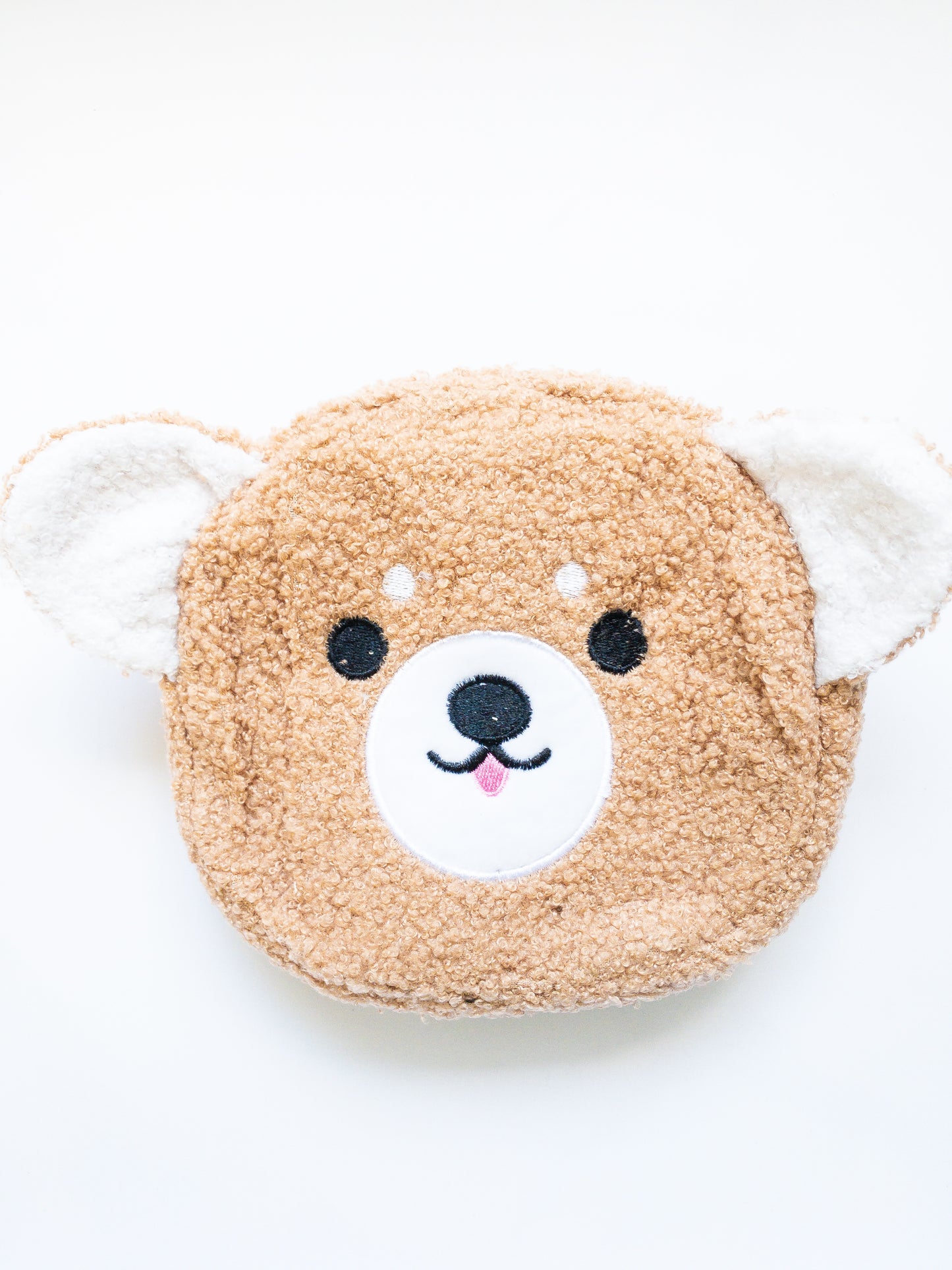This soft, sherpa, fuzzy happy faced Shiba Inu bag is just the cutest! Fabric strap is adjustable and removable. One zip open to a single compartment purse. Great length and size for kids! 
