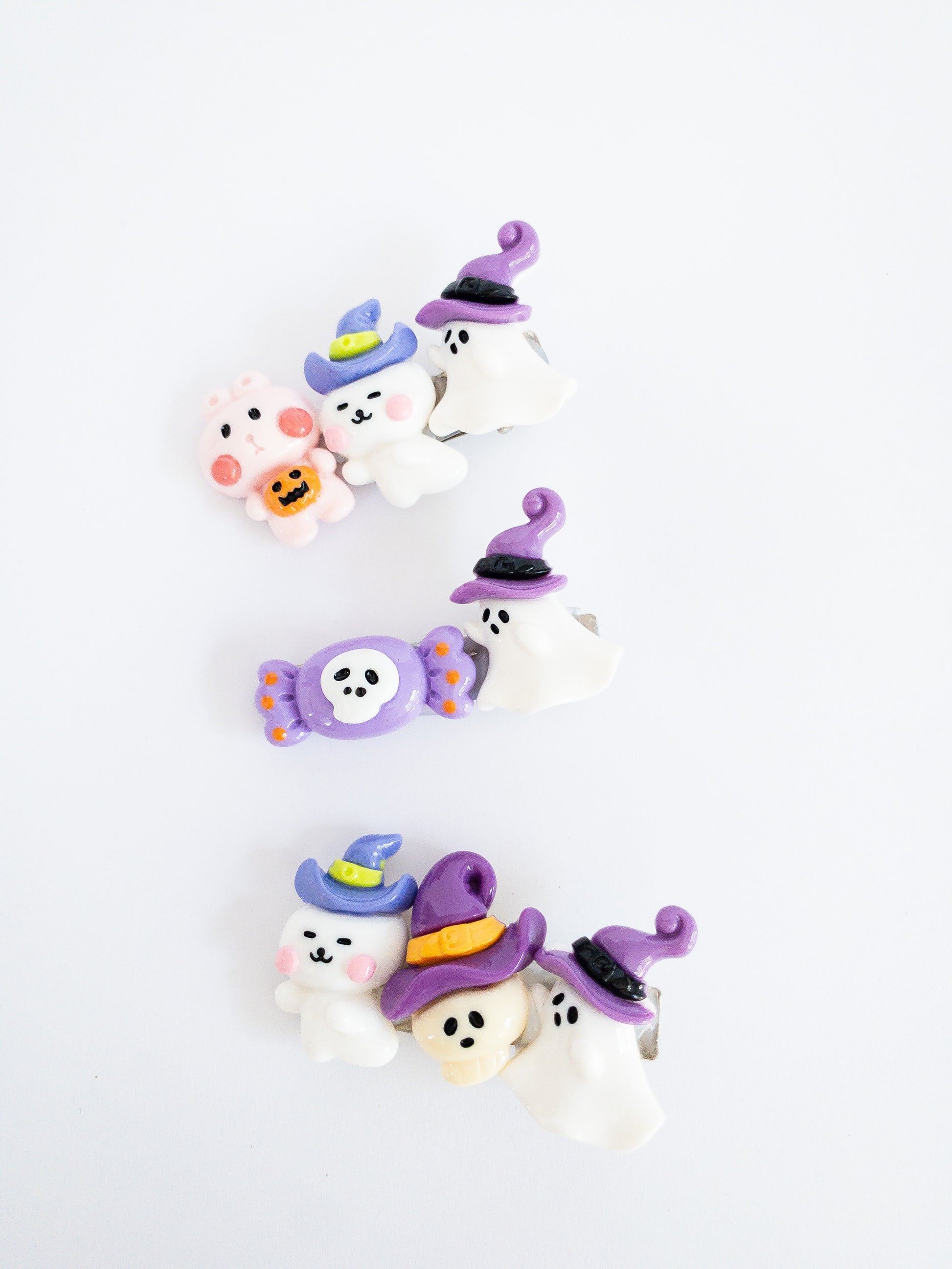 A rabbit, ghost witch, and skeleton go trick or treating in this fun, festive hair clip set. Each set comes with 3 hair clips with a variety of characters each on an alligator clip.