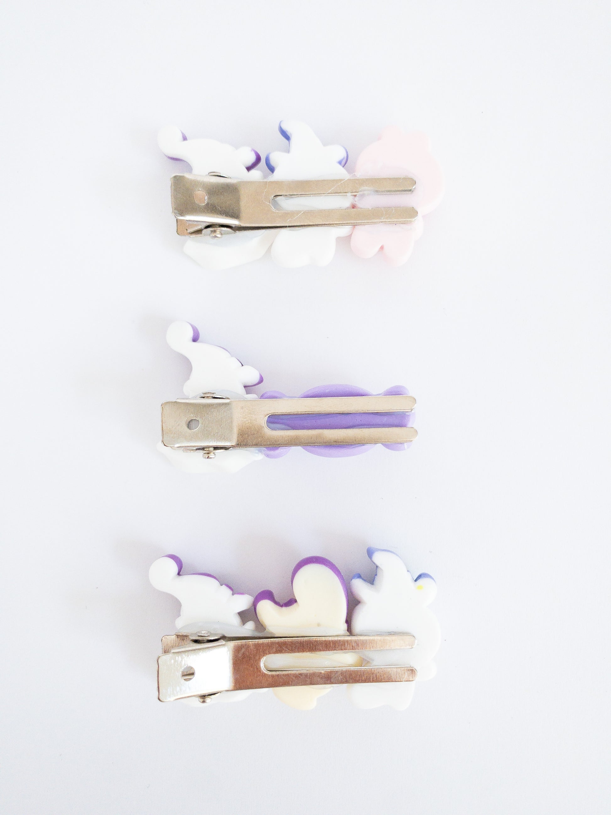 A rabbit, ghost witch, and skeleton go trick or treating in this fun, festive hair clip set. Each set comes with 3 hair clips with a variety of characters each on an alligator clip.