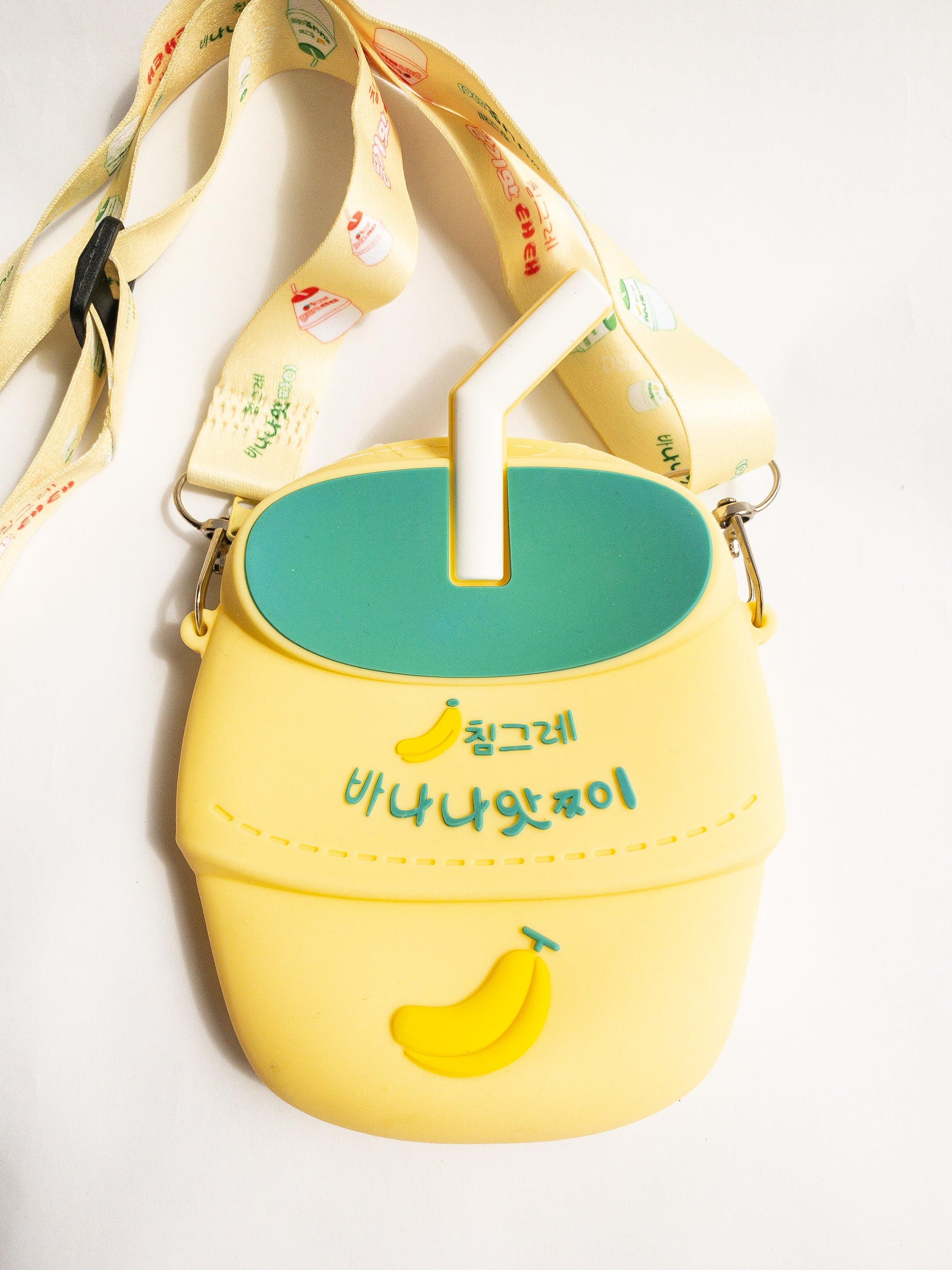 A bag shaped like your favorite childhood (and current!) beverage. This banana milk shaped bag is made of smooth silicone. It has one zip open with an adjustable fabric and removable strap. Sure to be a big hit!