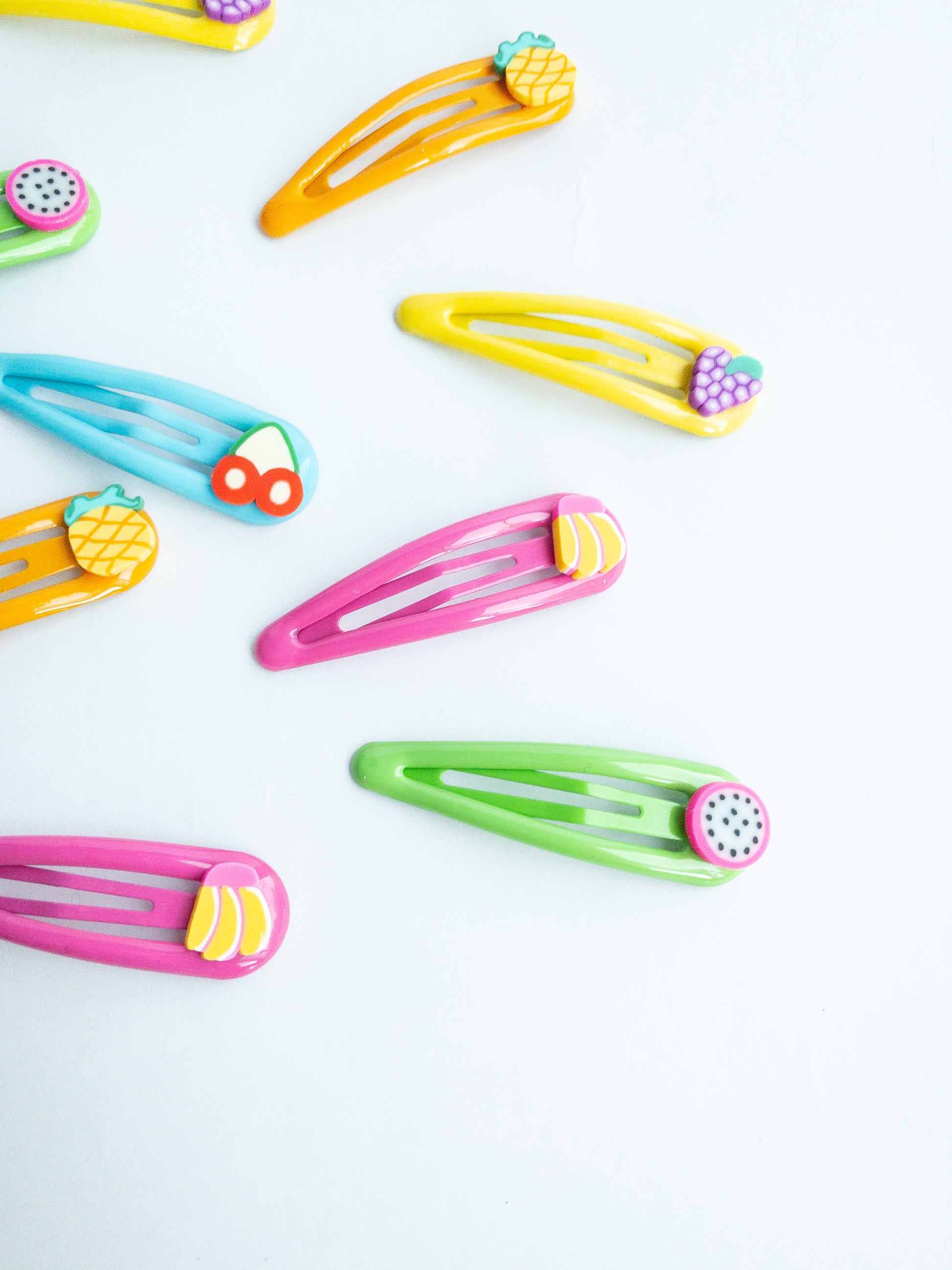 Add a sweet touch to your look with our adorable Little Fruits Hair Clips! These colorful clips come in a variety of fruit shapes and colors to brighten up any 'do. There's a dragon fruit, grapes, banana, cherry, and pineapple.