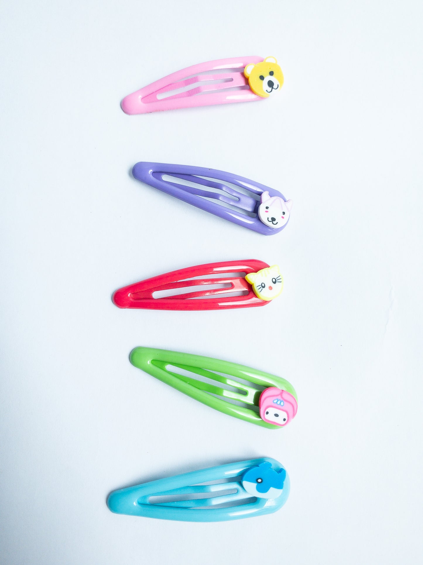 Adorn your 'do with these cute little animal hair clips! Featuring an array of critters, these super-cute clips are perfect for adding a bit of fun to your look. Five bright colored snap clips.