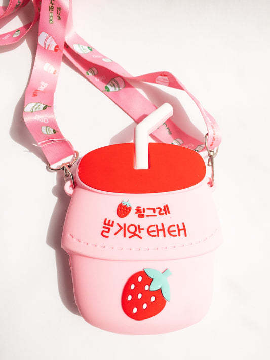 A bag shaped like your favorite childhood (and current!) beverage. This strawberry milk shaped bag is made of smooth silicone. It has one zip open with an adjustable fabric and removable strap. Sure to be a big hit!