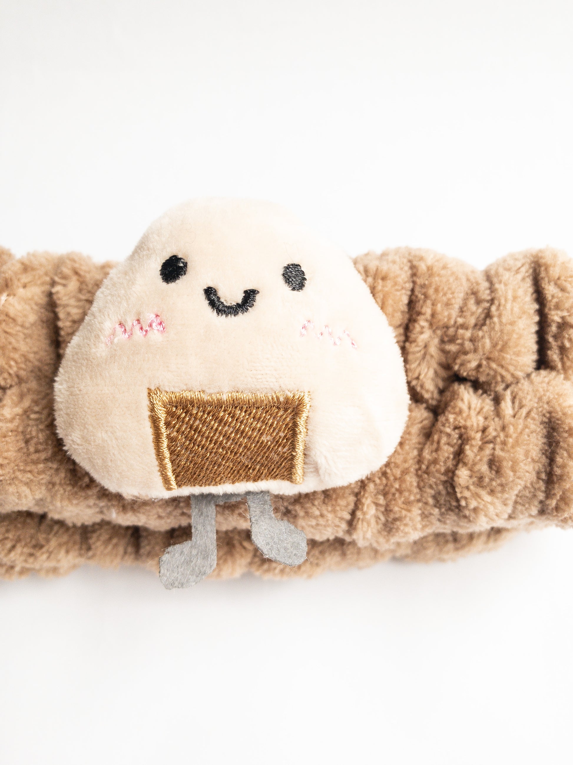 Our adorable onigiri plush spa headband makes the perfect accessory for all your spa days! Each headband is so soft and comfy with a cute rice ball (ju-mok bap in Korean). Pamper yourself in plushy-goodness and sweet, sweet relaxation! Go ahead, you deserve it!