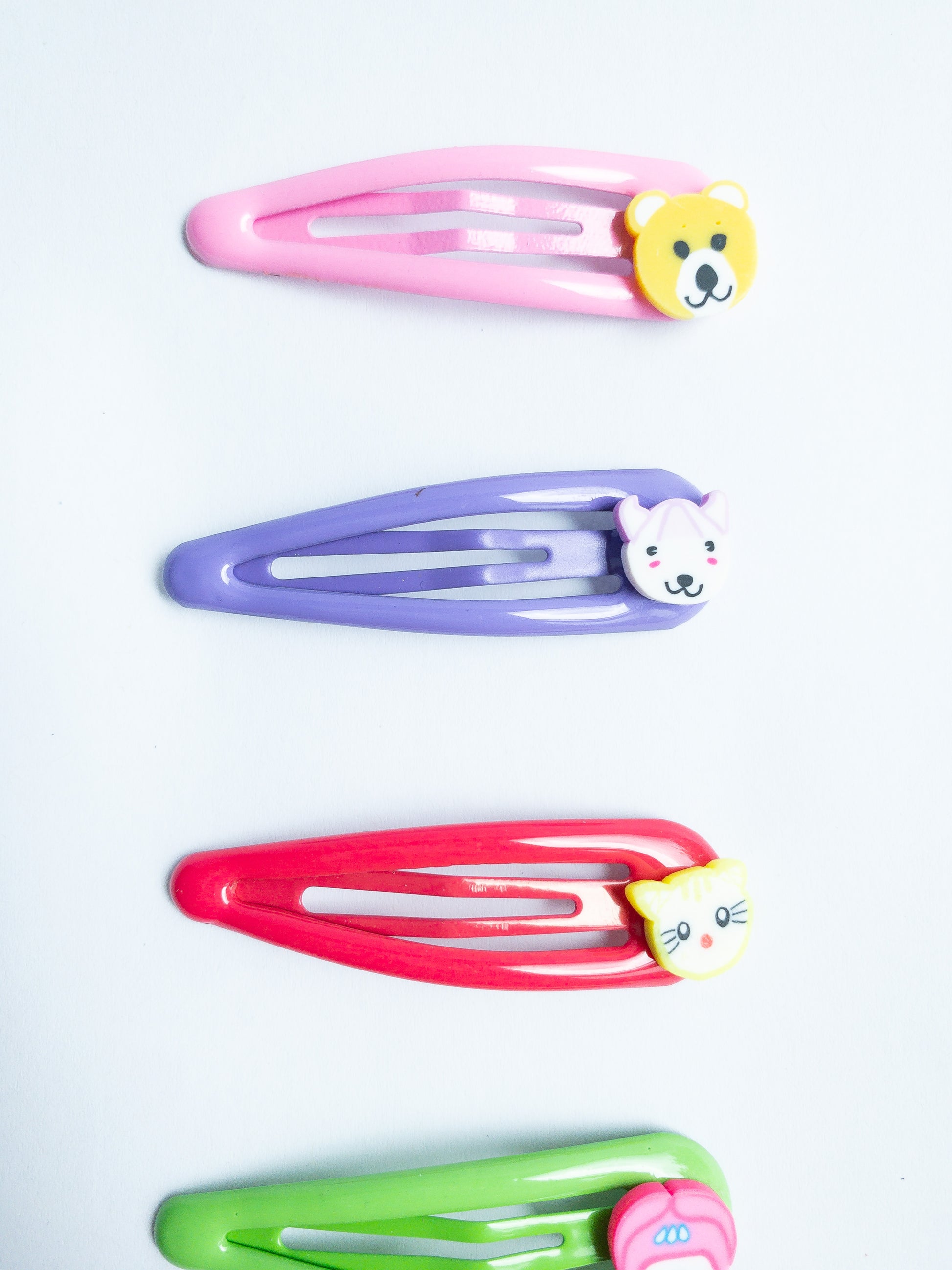 Adorn your 'do with these cute little animal hair clips! Featuring an array of critters, these super-cute clips are perfect for adding a bit of fun to your look. Five bright colored snap clips.