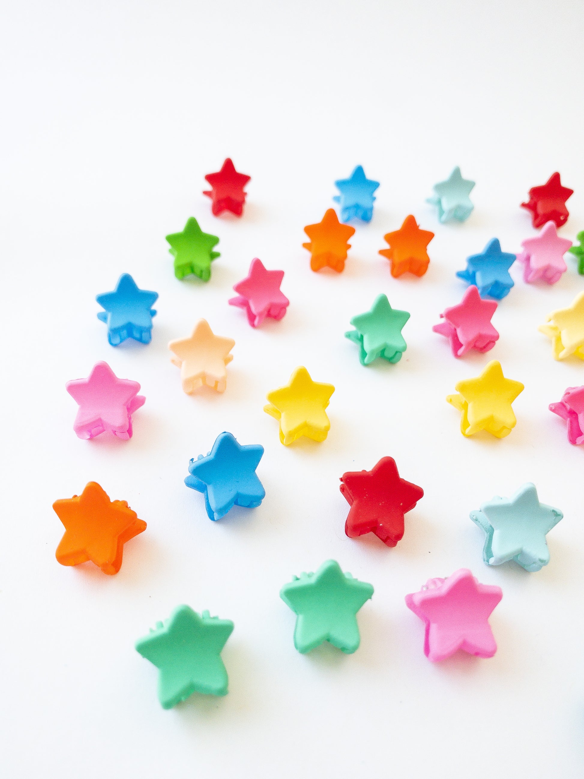 Our signature Korean style mini star hair clips! Each hair clip is only half an inch in length and is great for clipping your hair back in pretty starry rows or using one or two to keep your hair from your face. Each box comes with 36 dainty pieces in a variety of pretty colors in our very own Eggy Cakes box. These really are a must have!