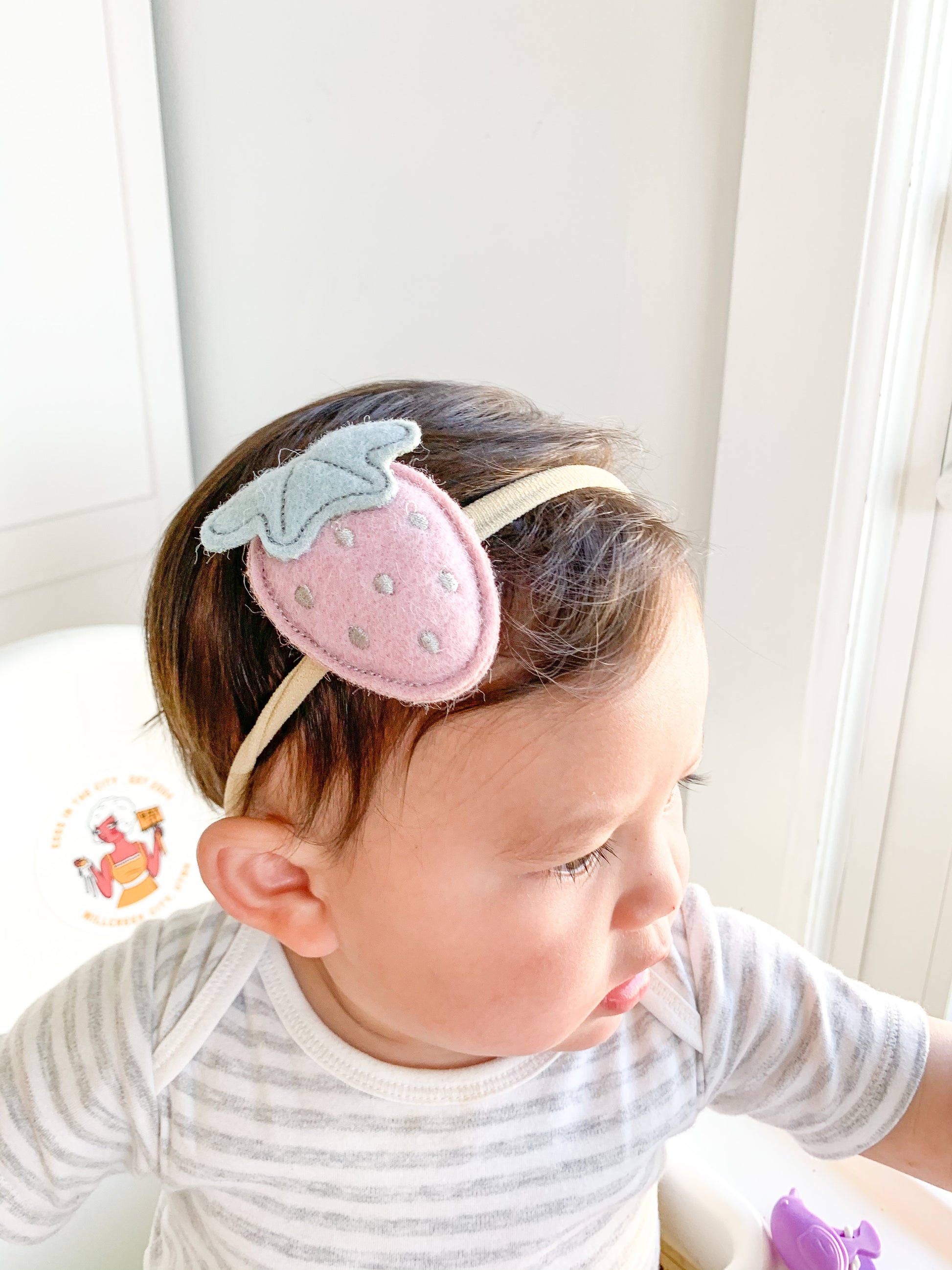 Our mascot fruit, the strawberry, in a soft pink plush form on an elastic nylon headband for your little! Great for kids with little to no hair. The nylon elastic is super stretchy and super soft.