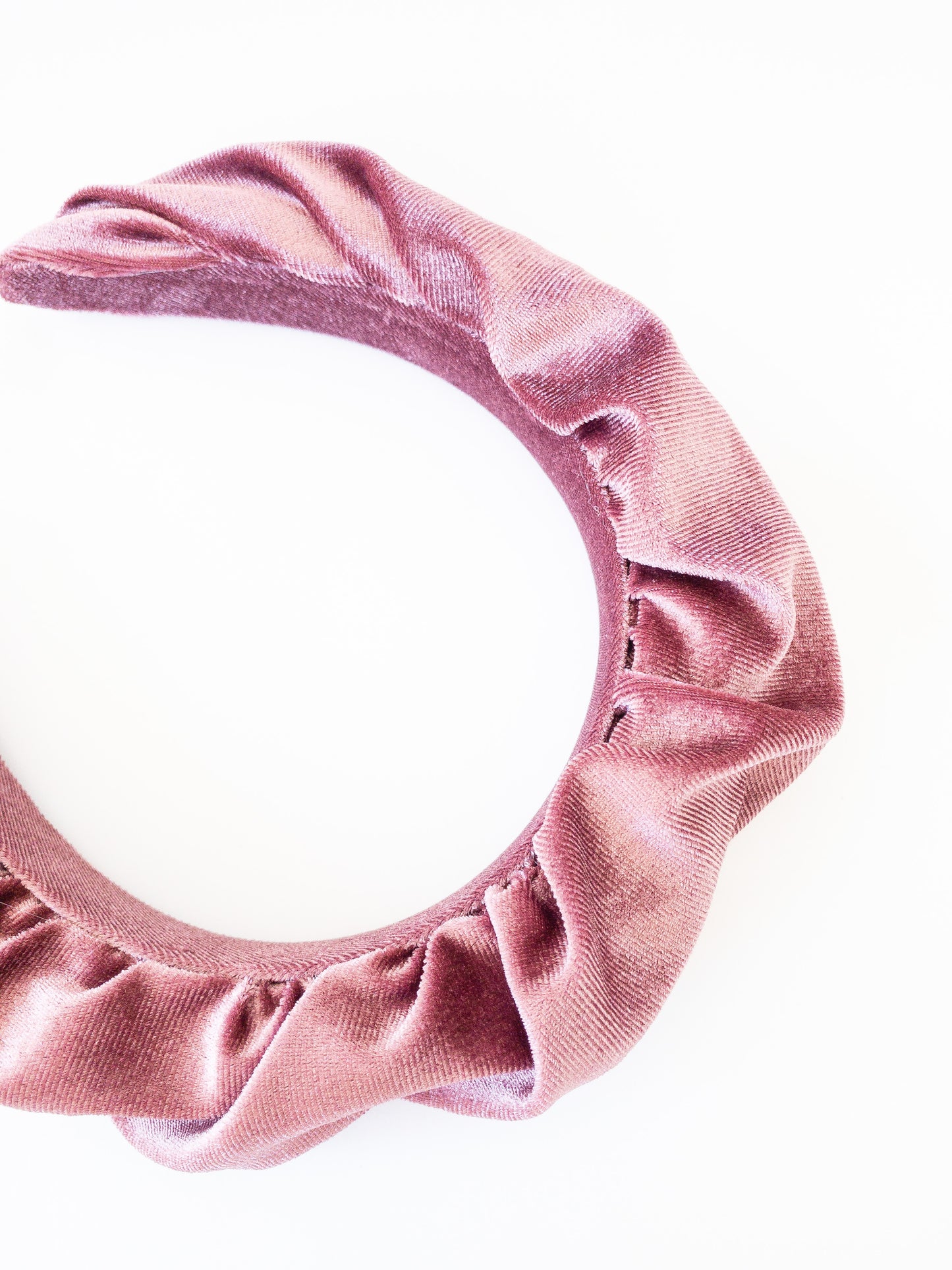A rich, beautiful statement piece! This headband is padded and ruffled in soft, gorgeous velvet and is the perfect piece to wear out on a date or girls night out. 