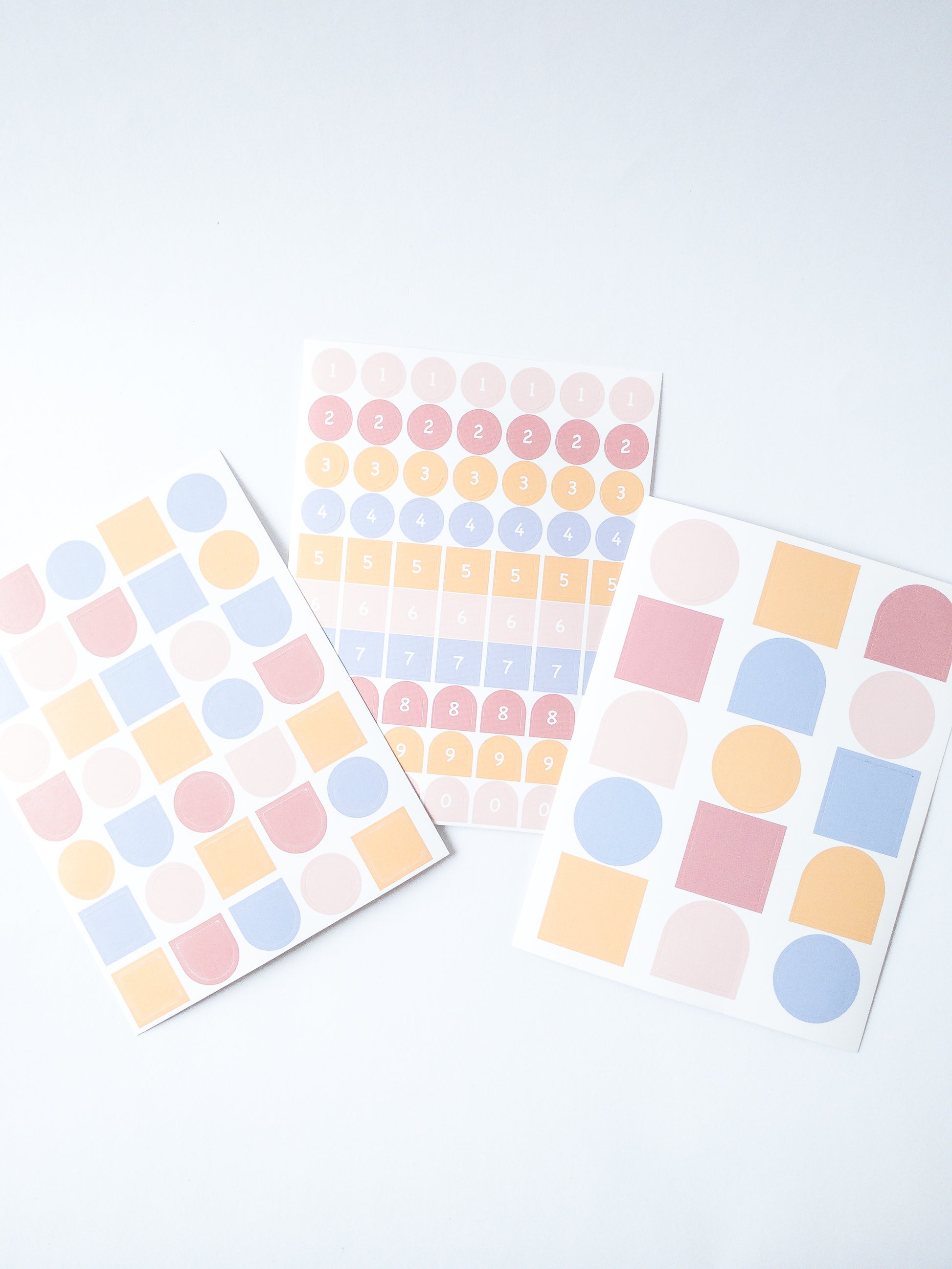 120 Korean style stickers! Three sheets of shapes and numbers in pretty pastel colors. There are 70 mini number stickers, 35 medium-sized shape stickers and 15 large shape stickers.
