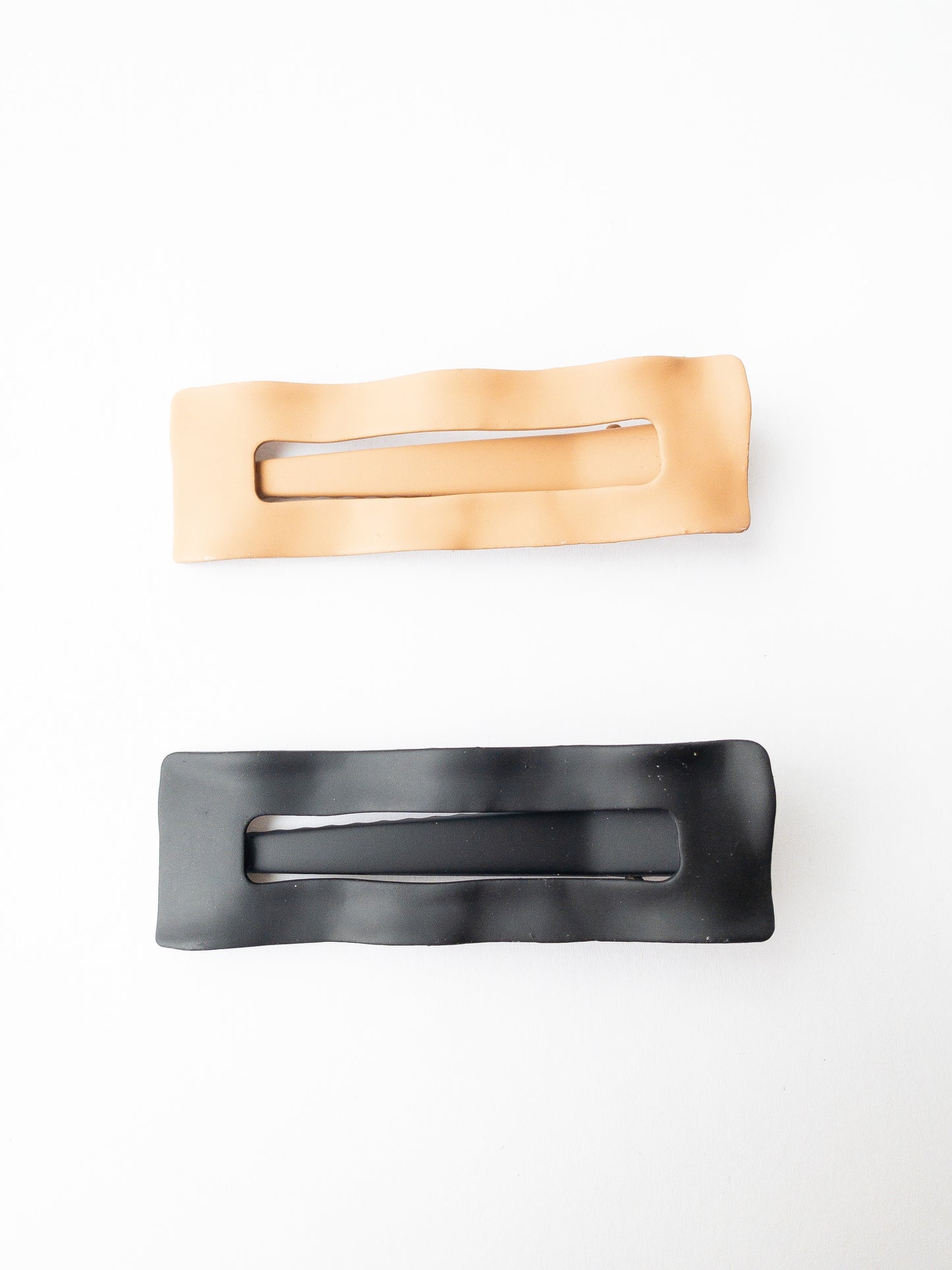 Wavy and chic, these barrettes come in two very modern matte colors: latte and black. These grip so well! And are sturdy yet lightweight to hold your hair beautifully. 