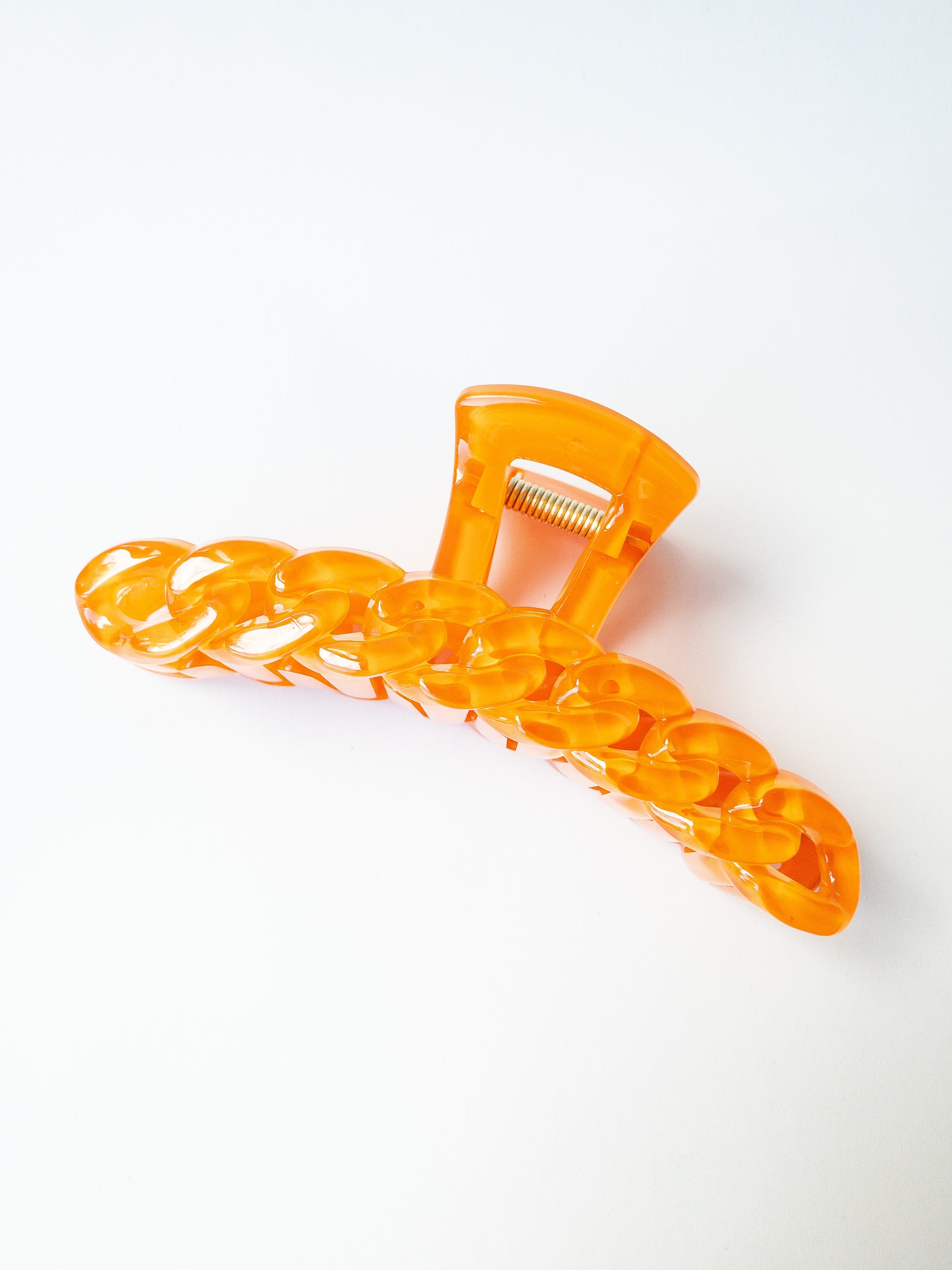 The brightest chain link hair claw clip in the most delectable candy hue! This orange hair claw is large in size and strong enough to sweep up your hair in a messy updo. You're going to want one in every color!