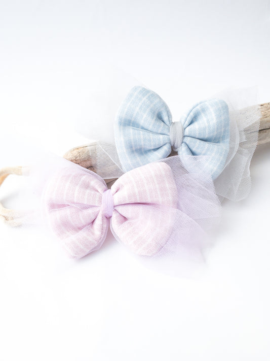 This set is so whimsical! Each set comes with 2 headbands. Each bow, in both pink and blue, is a plaid pattern which is then encased in this beautiful, soft and airy tulle.   Great for kids with little to no hair. The nylon elastic is super stretchy and super soft.