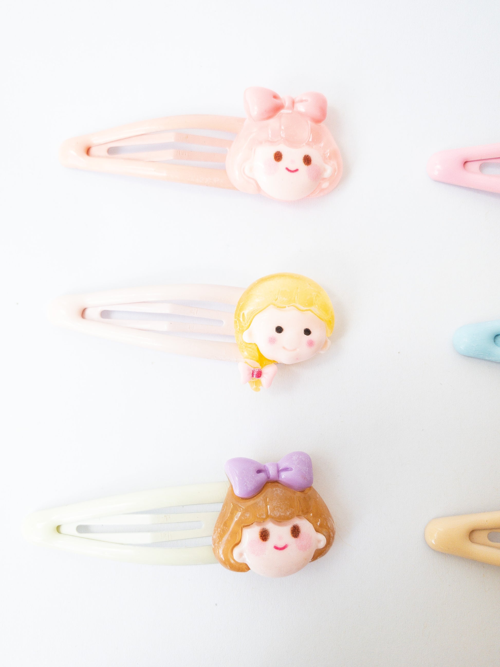 A sweet and mighty set of cartoon girl characters on glossy, pastel snap clips! Each set has 8 girl charms with a cute b