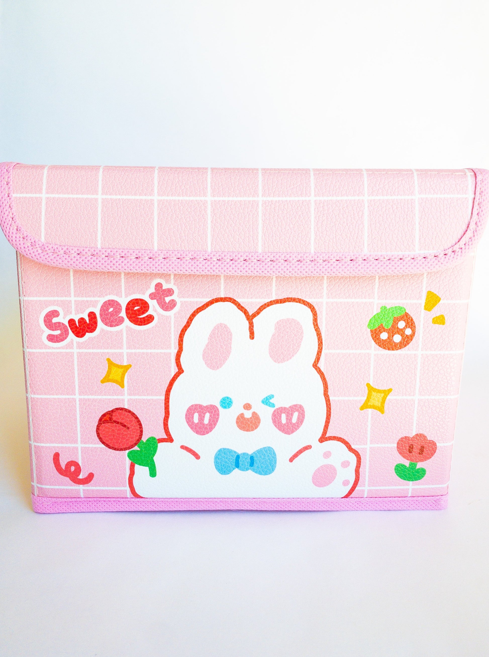 A multi-use, versatile storage box and the perfect place to throw all your Eggy Cakes hair clips in. The lid folds over and has a velcro close and it's large enough to hold pencils, markers, stickers, makeup, you name it