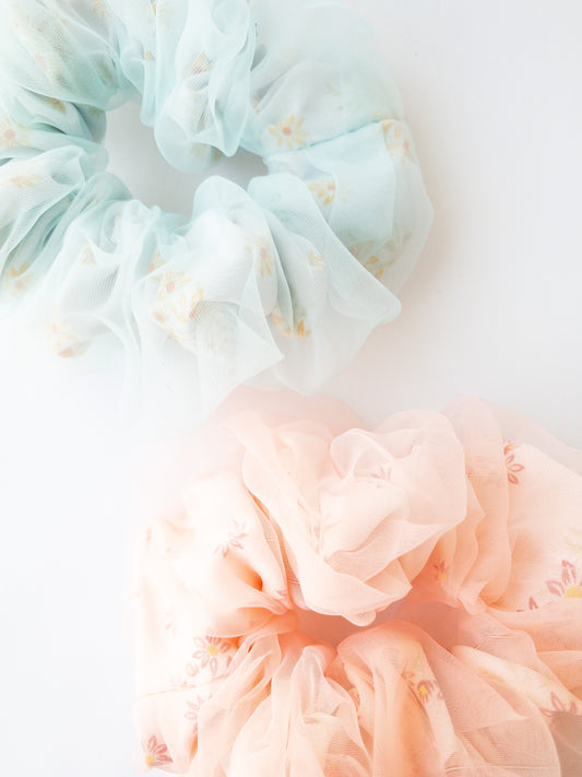 Two beautiful large scrunchies that bring a pretty pop to your hair! Each set comes with one blue and one pink and each scrunchie has an inner floral pattern layer and an ethereal organza outer layer making your ponytail gorgeous.