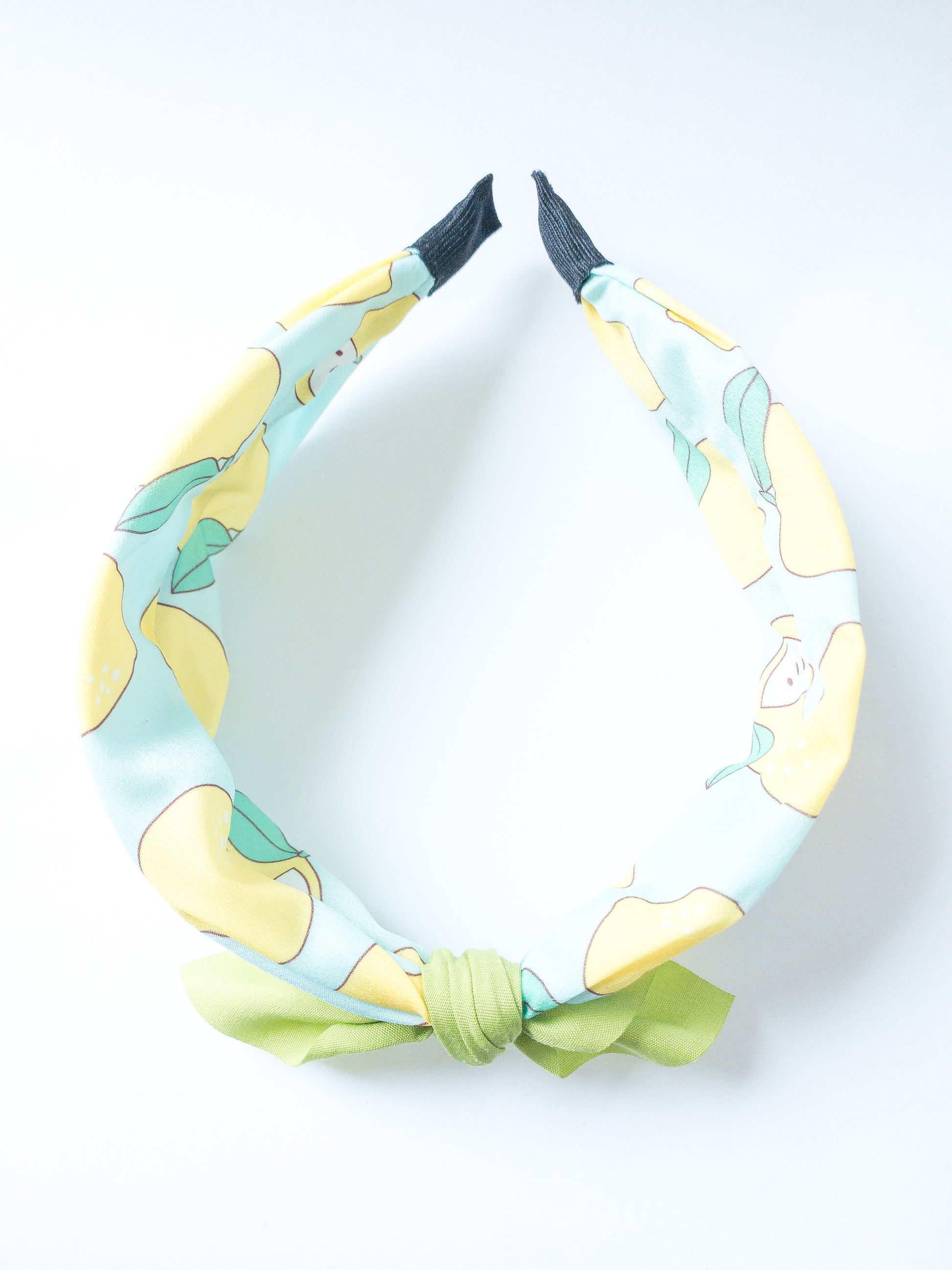 Not only is this headband so so cute, but it is also very comfortable! Each headband is wrapped in a silky fruit patterned fabric with a solid color bow at the top. The ends are also wrapped in fabric. Choose from four different fruits/colors. Best suited for a child.