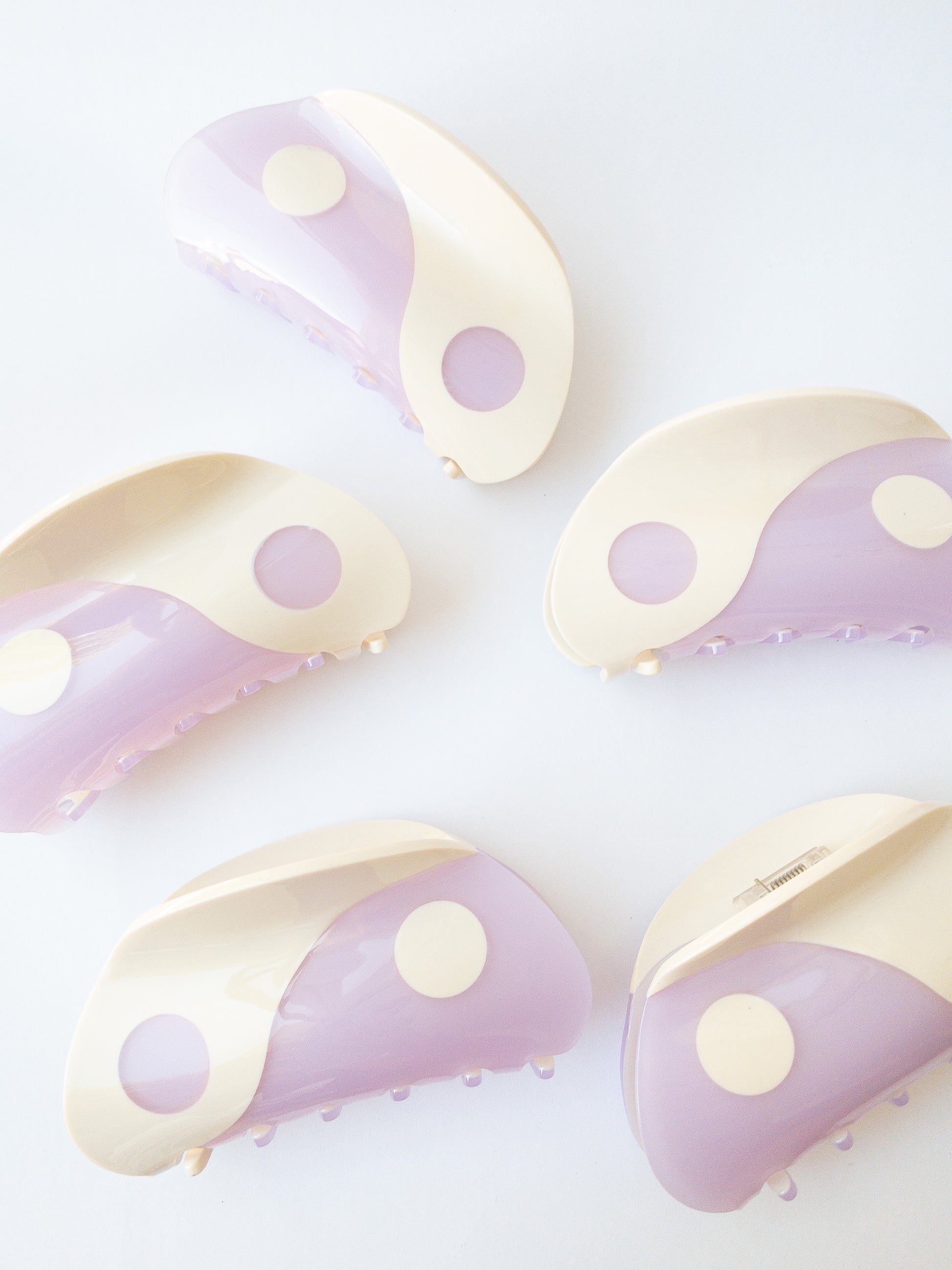 Large yin yang hair claw clip with a beautiful curve of lilac purple and cream white colors. This claw is shiny and strong, a great everyday staple.