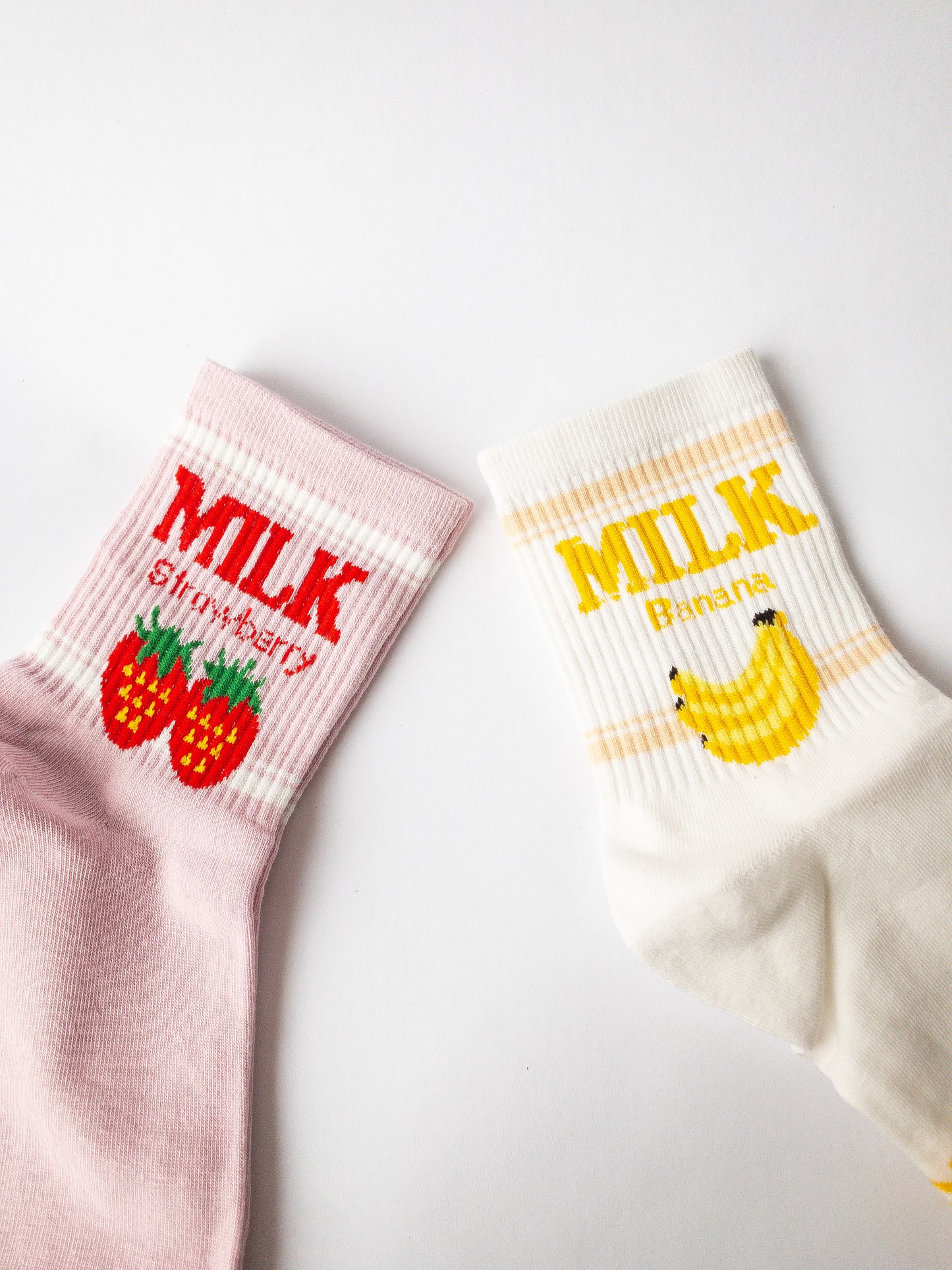 The most delicious duo of fruit flavored milks! A pink strawberry milk pair and a white banana milk pair. Adult size 4-10 crew socks come up above the ankle.