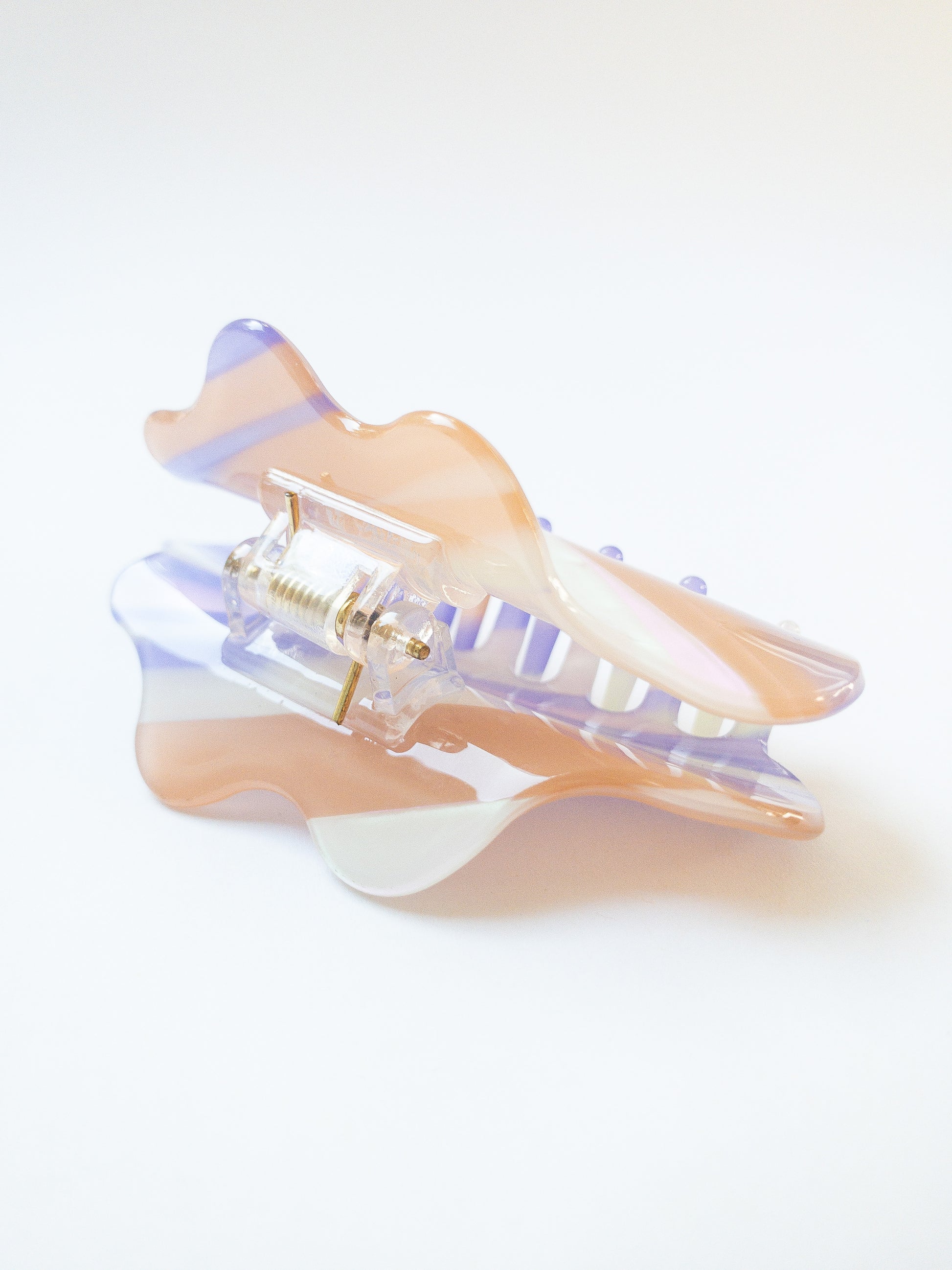 A gorgeous resin acetate cloud shaped hair claw. Each hair claw has unique, beautiful flecks, shimmer and plum purple color. What prettier way to clip back your hair than this dreamy cloud hair claw clip. 