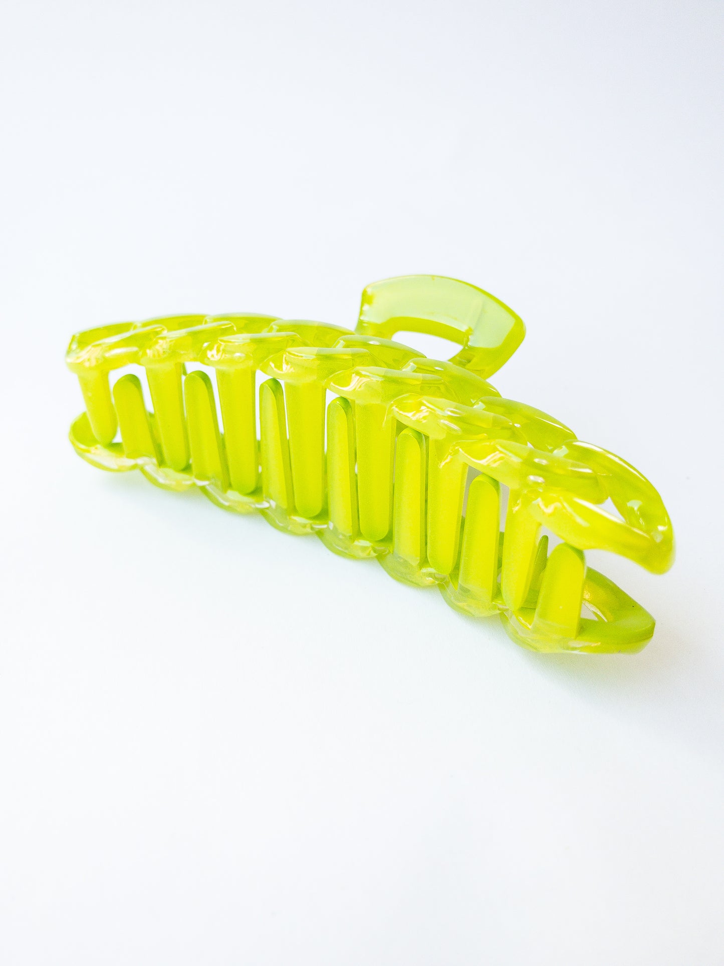 The brightest chain link hair claw clip in the most delectable candy hue! This green hair claw is large in size and strong enough to sweep up your hair in a messy updo. You're going to want one in every color!