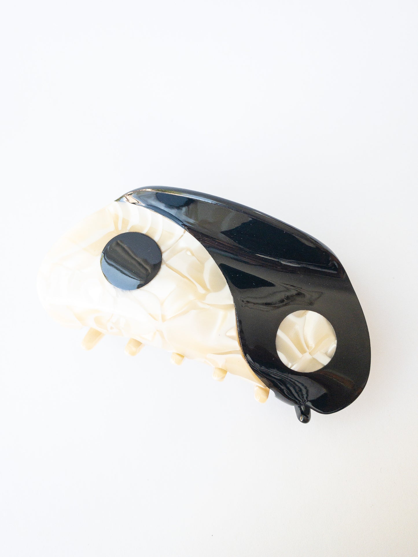 Large yin yang hair claw clip in a beautiful swirl of cream white and midnight black colors. This claw is shiny and strong, a great everyday staple.